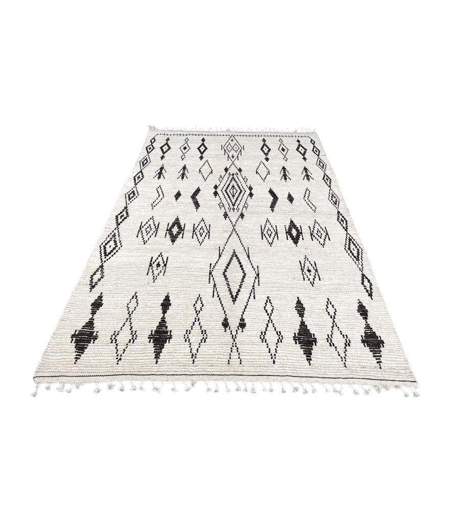 A vintage handwoven Moroccan berber rug, with tribal pattern For Sale 2