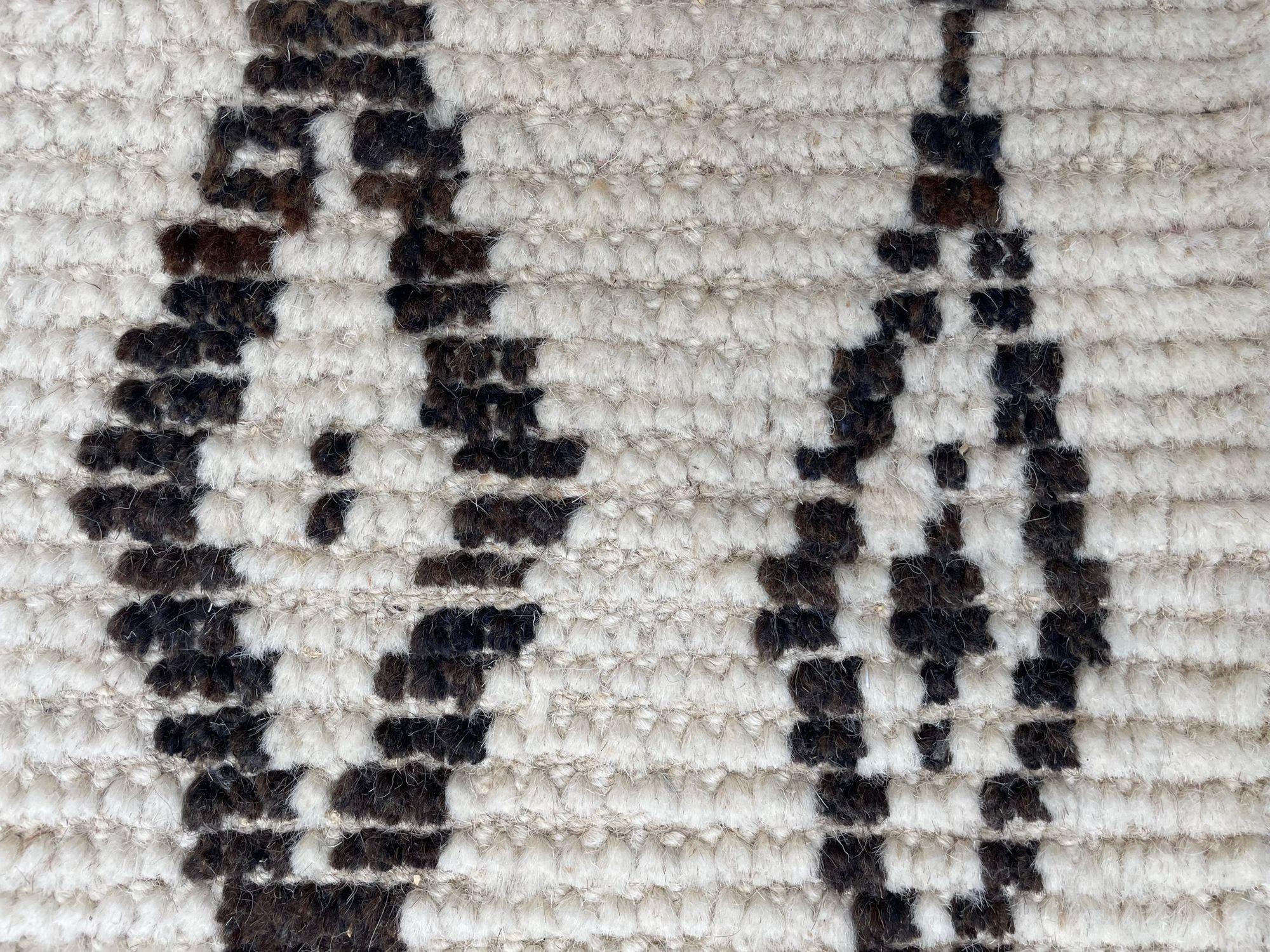 A vintage handwoven Moroccan berber rug, with tribal pattern For Sale 4