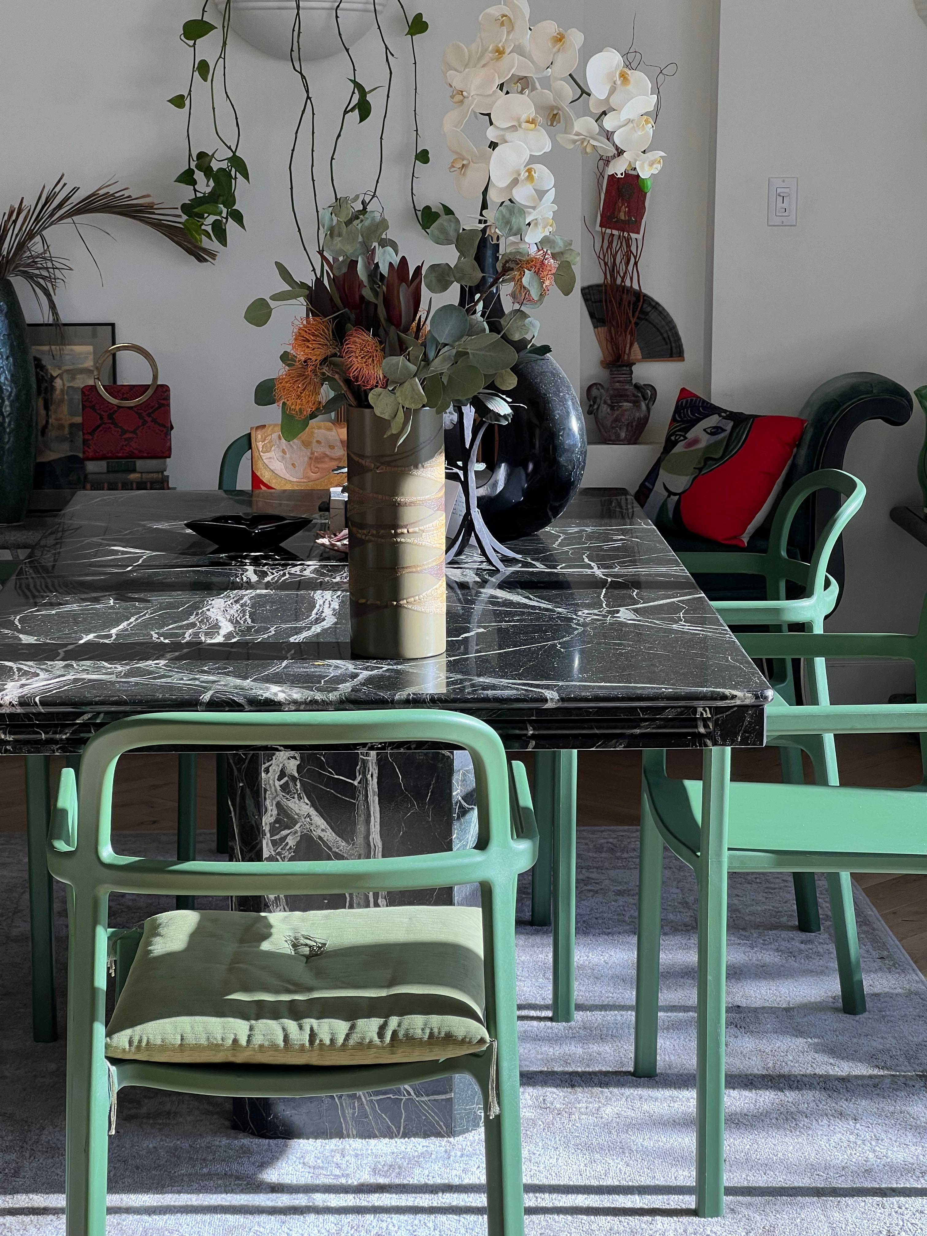 A vintage Italian black marble pedestal dining table, Italy mid to late 20th century. A stunning piece with hand-carved edges, boasting neoclassical sensibilities and yet firmly rooted in postmodern aesthetics. The top can be removed for easier