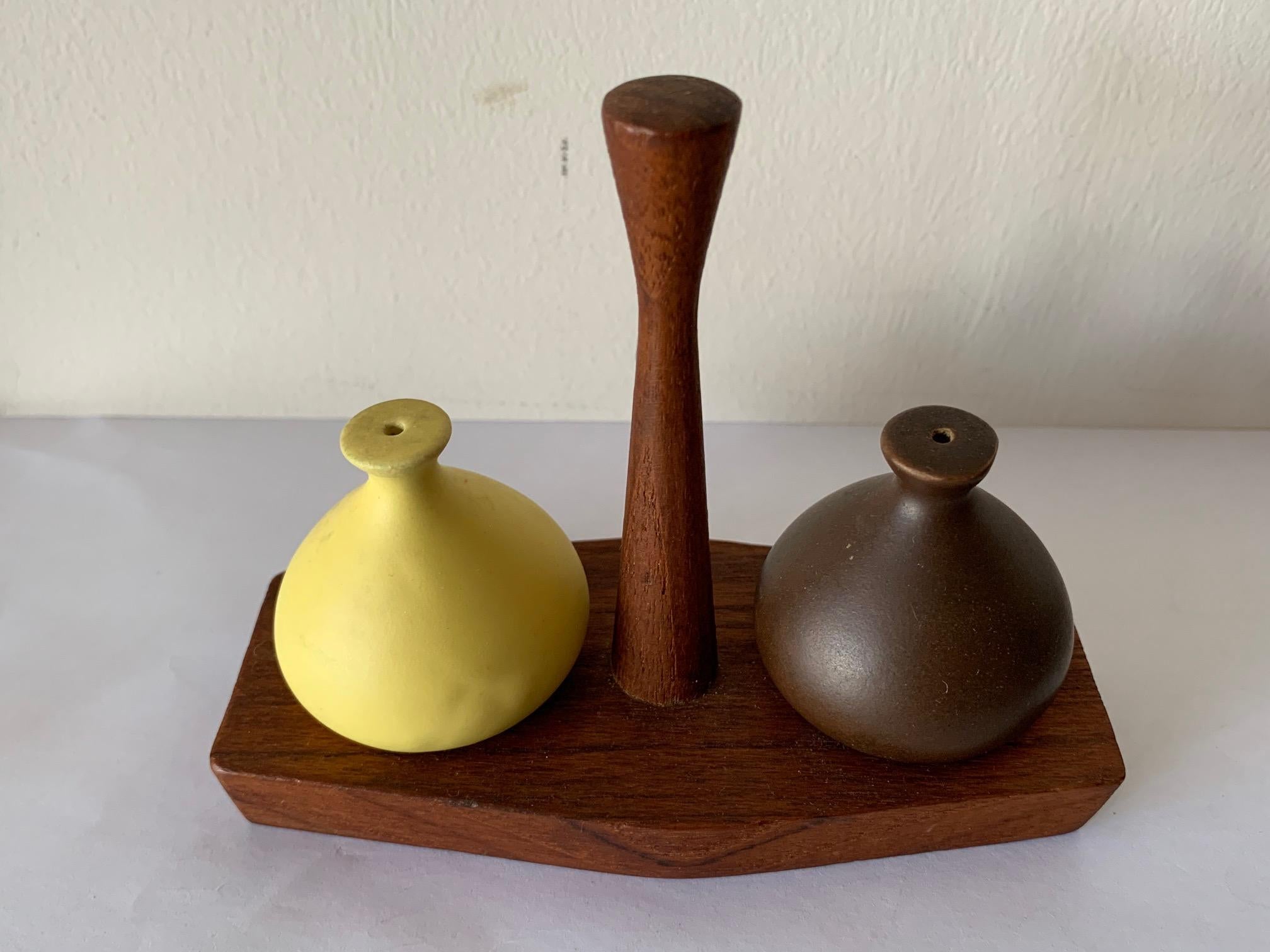 A charming salt and pepper set by Arni Form, Italy, circa 1960. Teak wood and ceramic, handmade.