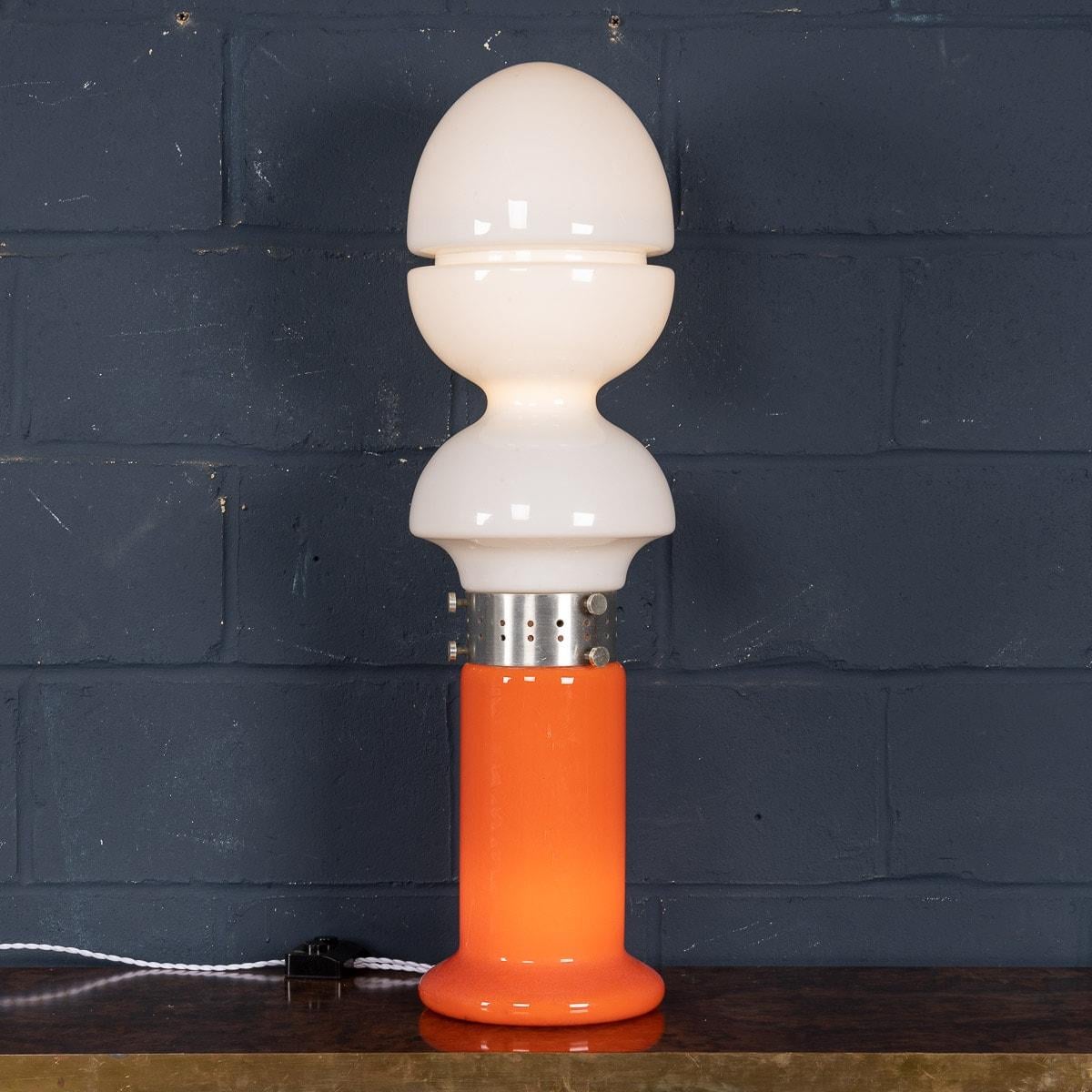 A wonderful vintage Italian table lamp made by Carlo Nason for Mazzega. Produced in Murano, Venice in the 1970s, this chrome and glass lamp exemplifies Carlo Nason’s workmanship. Using vibrant colours, Nason has used a bright orange glass for the