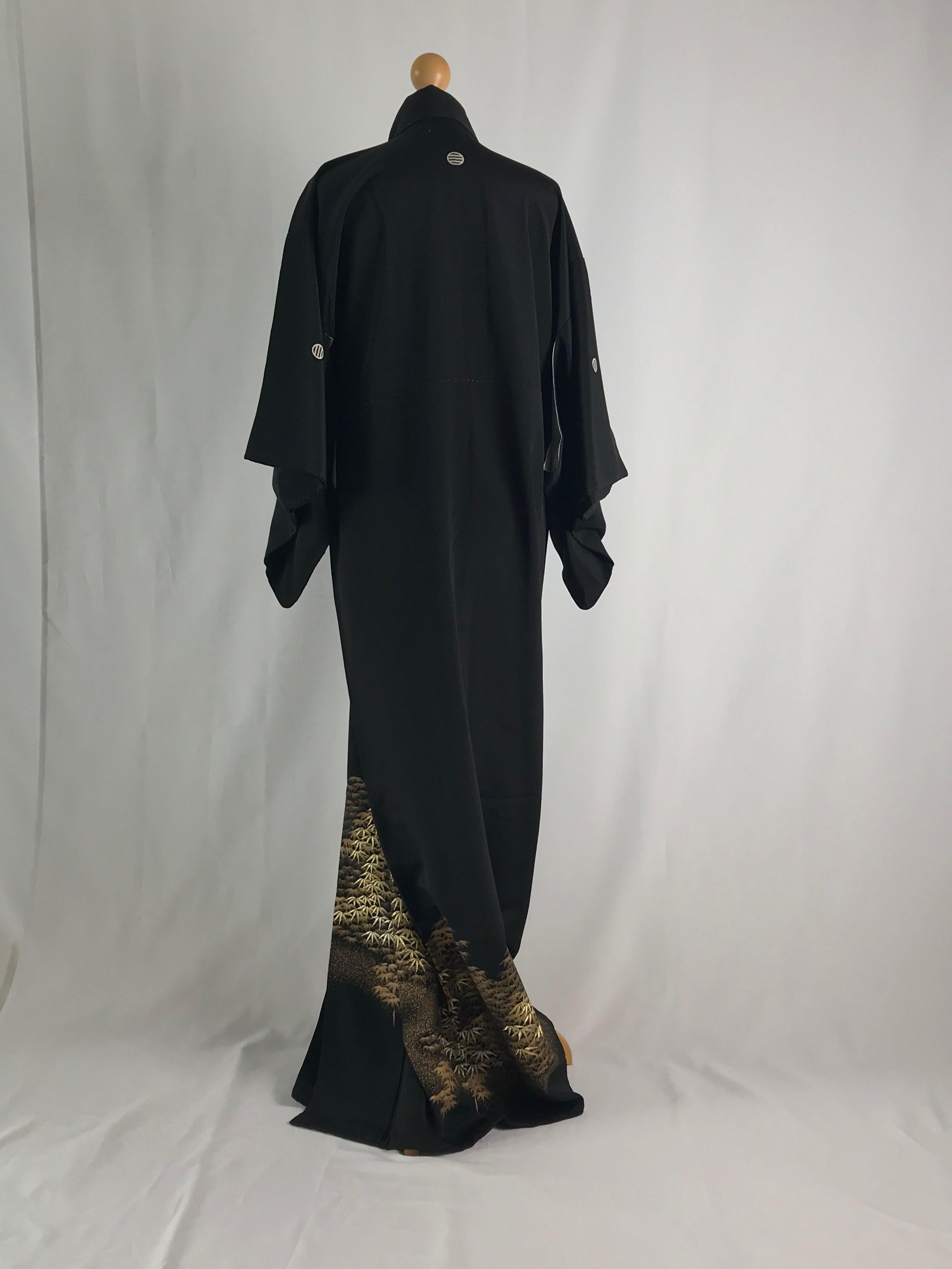 Black A vintage kimono embroidered and painted with golden maple trees.