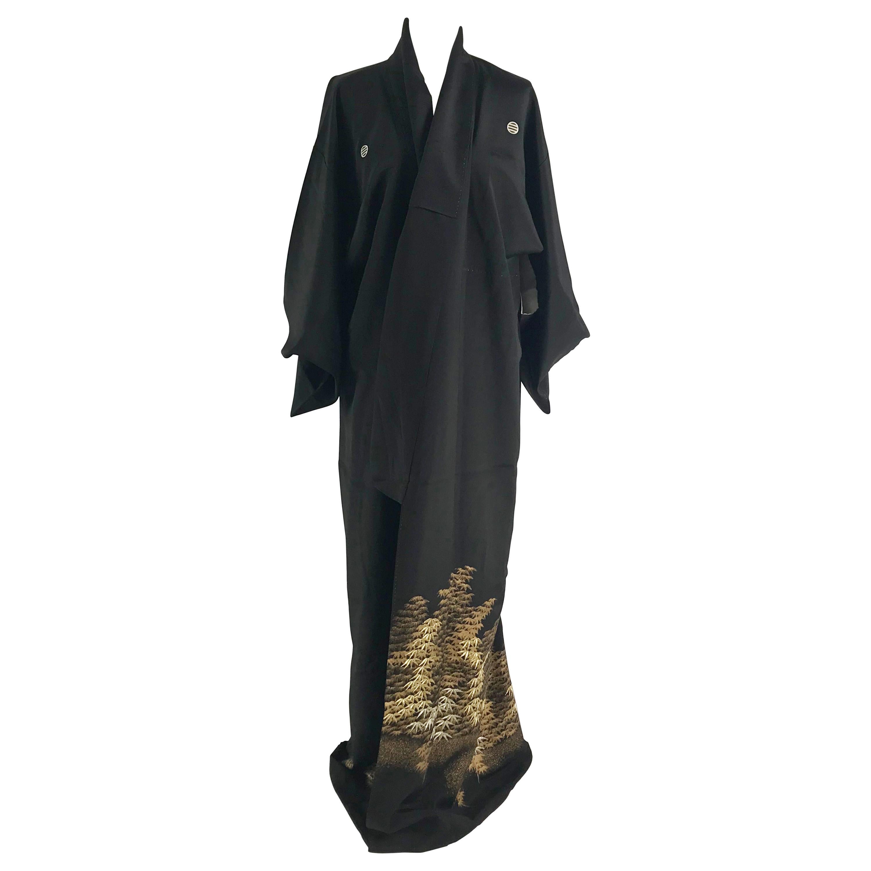 A vintage kimono embroidered and painted with golden maple trees.
