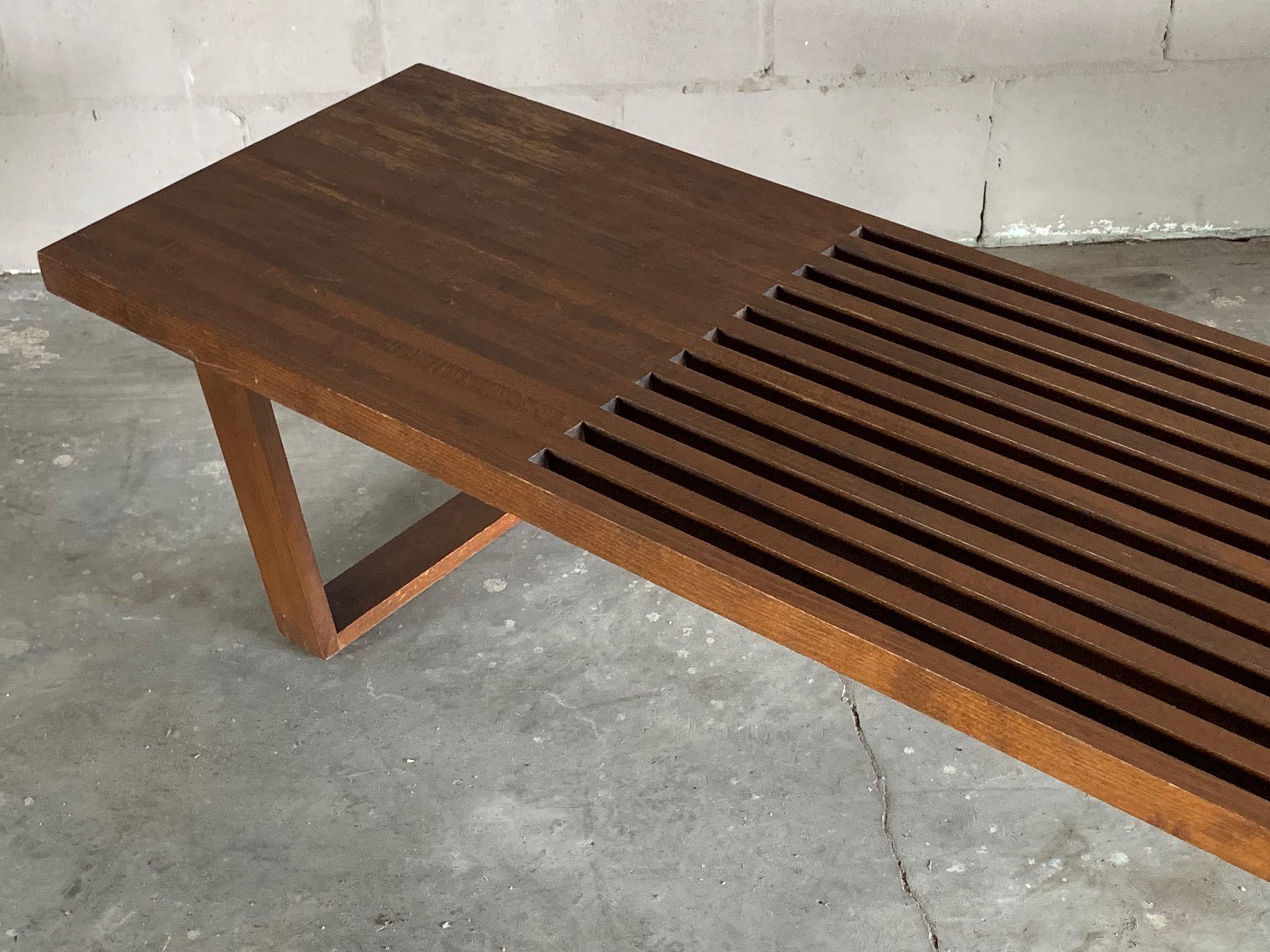 A Classic midcentury slat bench in the style of George Nelson, circa 1950s. Heavy and well made could used as a coffee table or display table.
