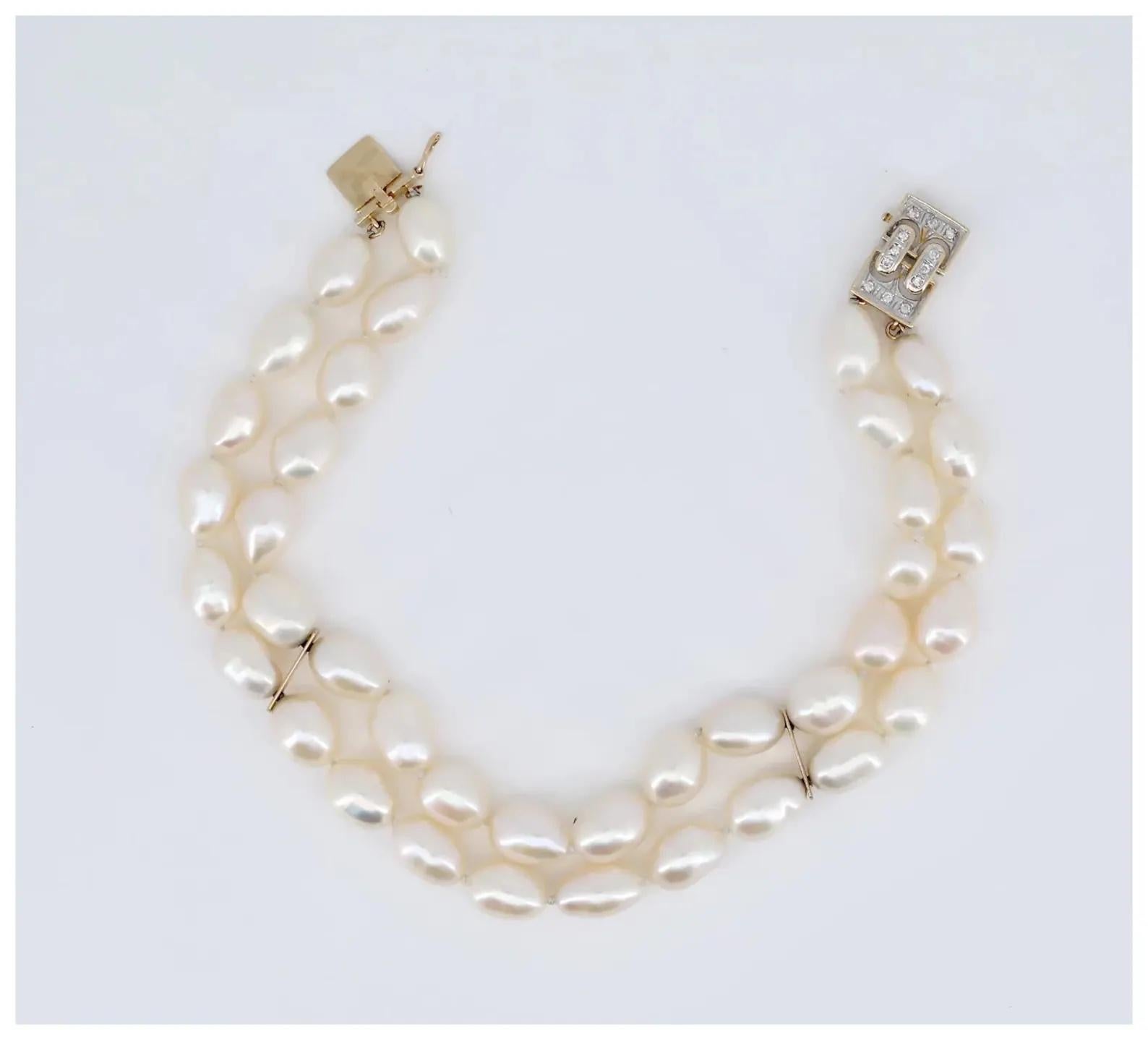 Round Cut A vintage Mikimoto signed double strand pearl bracelet mounted on 14 karat gold.