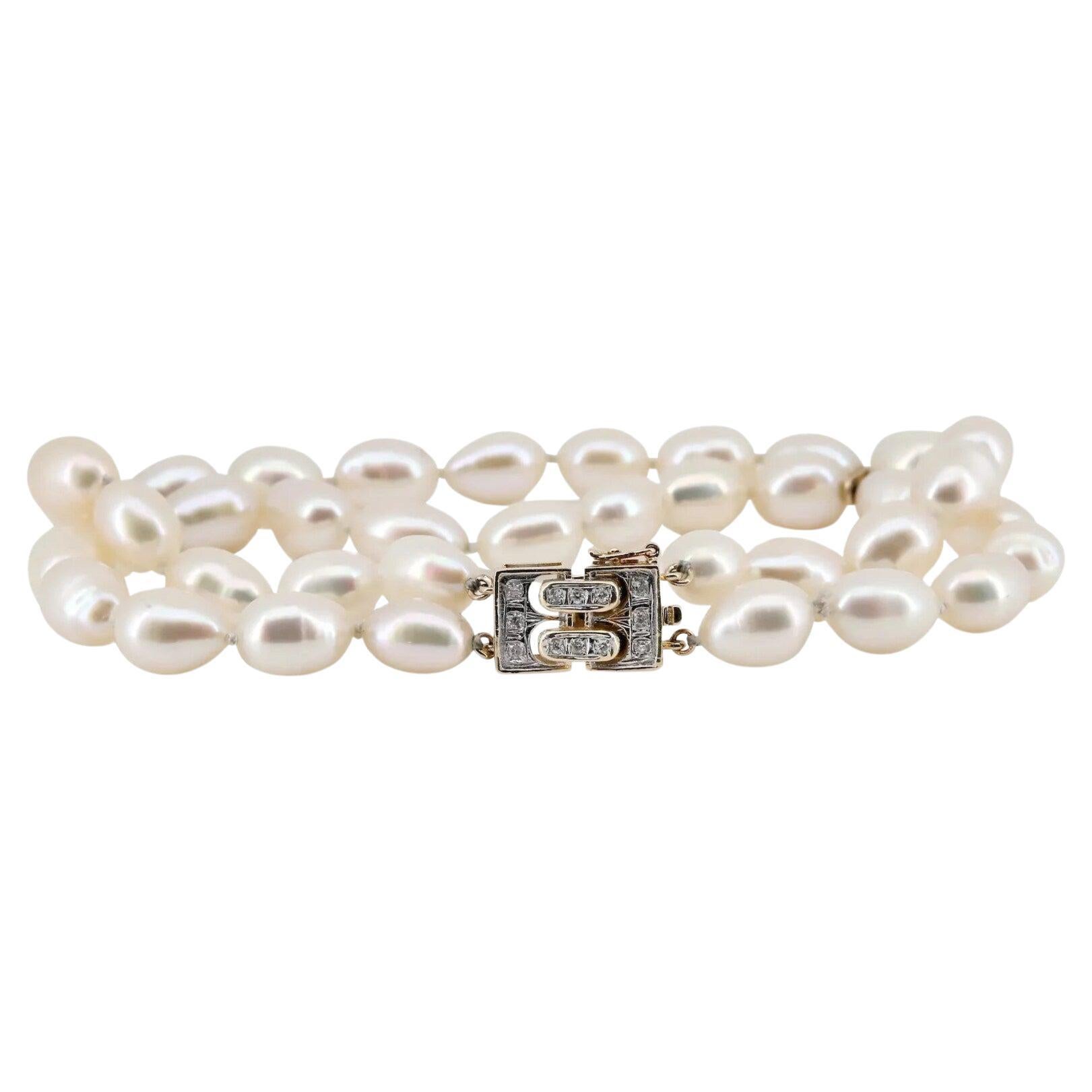 A vintage Mikimoto signed double strand pearl bracelet mounted on 14 karat gold.