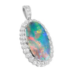 A Vintage opal and diamond pendant/ring