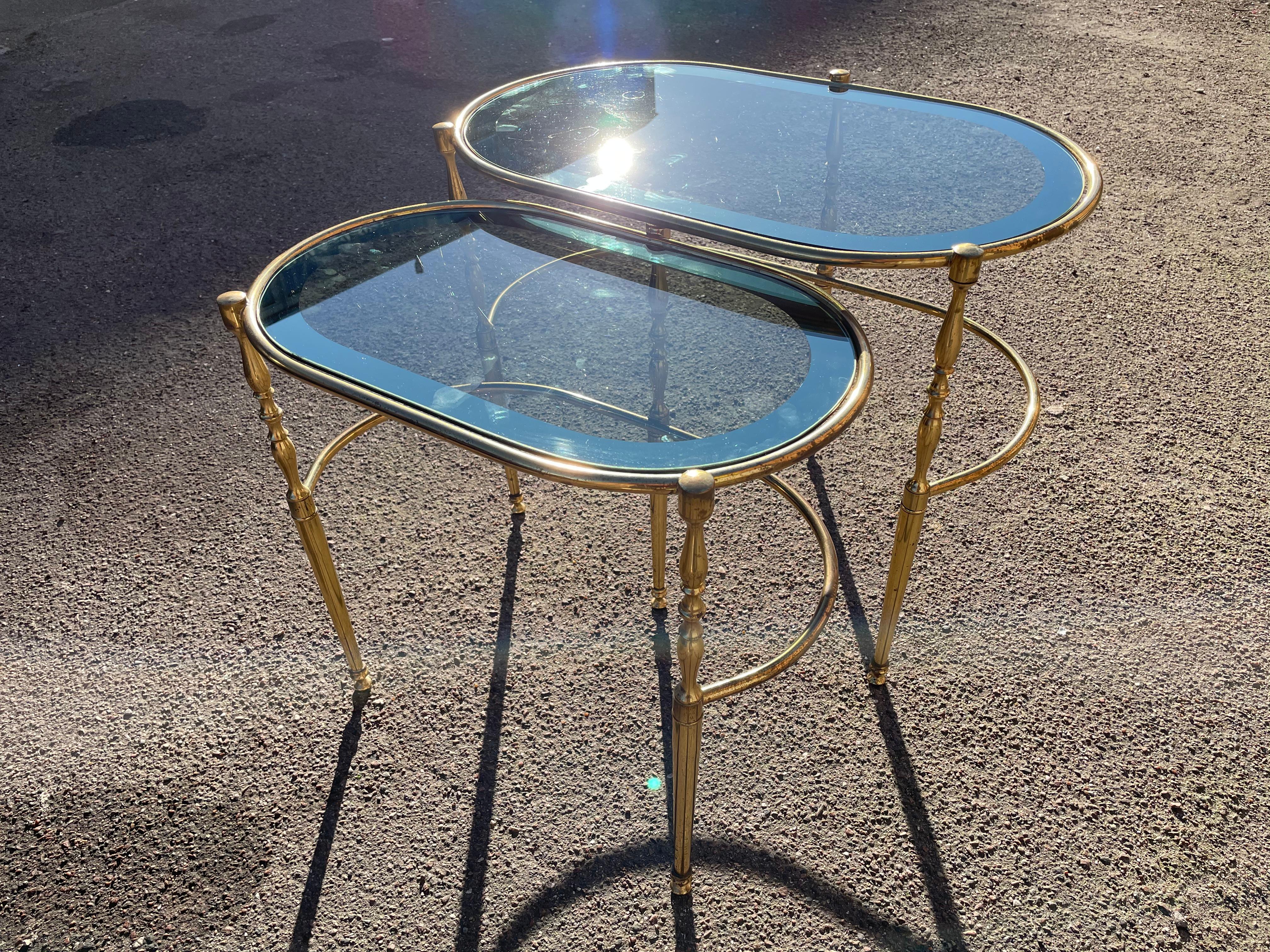 These elegant Mid-Century Modern tables from the 1970s are fragile but strong and long lasting from great craftsmanship. And with a beautiful shaded glass and finish.