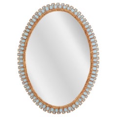 A Vintage Paneled Blue Glass Oval Wall Mirror.