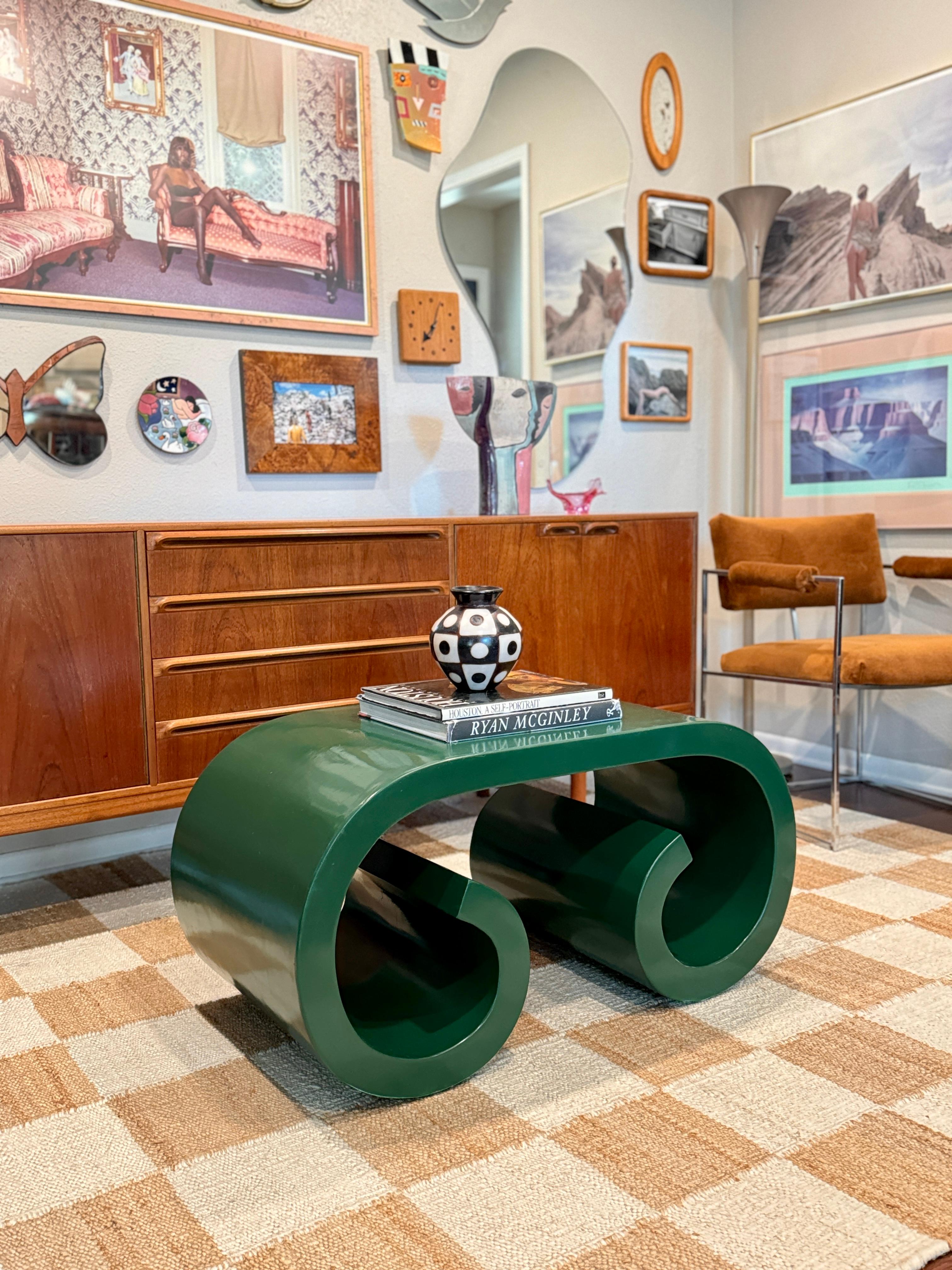 
A vintage petite post modern scroll coffee table in the style of Karl Springer, circa 1980s. Recently refinished in an emerald green lacquer. In very good condition. 

17.5” H x 36” W x 18” D