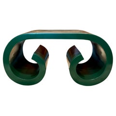 A vintage petite post modern scroll coffee table in the style of Karl Springer