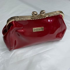 A 1980s Vintage Pierre Cardin Pink Plastic and Brass Handbag