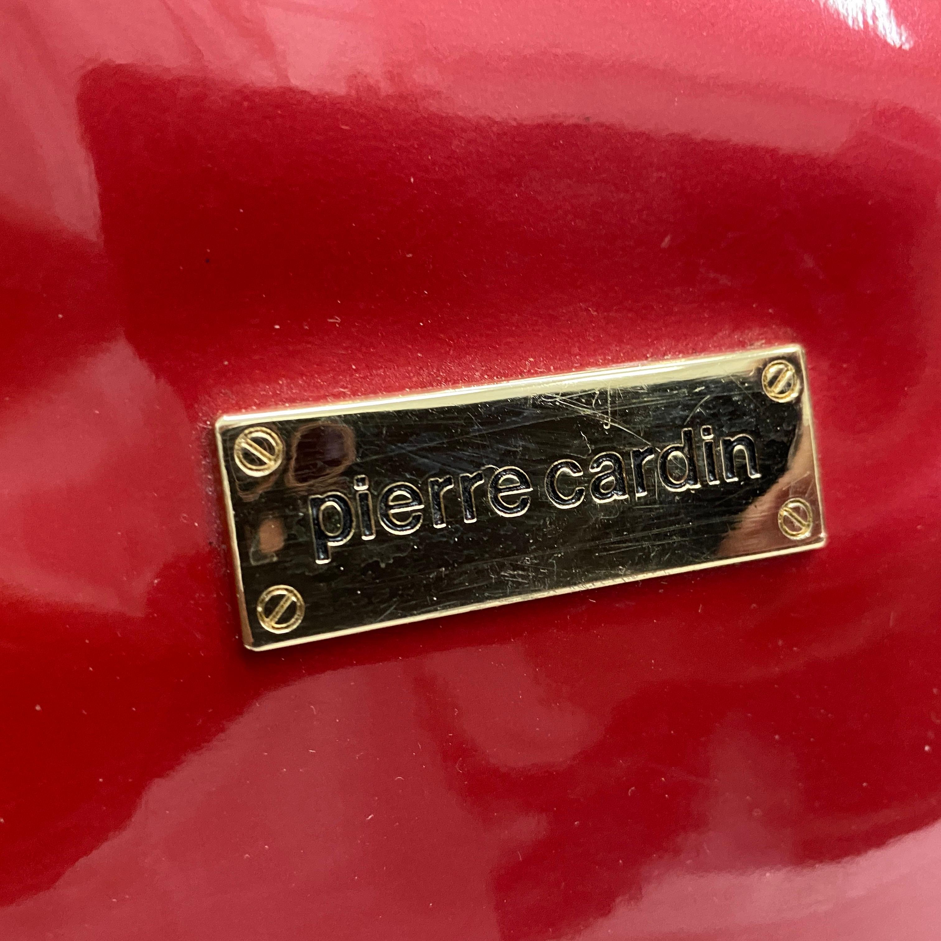 Femenino o masculino Bolso vintage Pierre Cardin de plástico rosa y latón de los años 80
