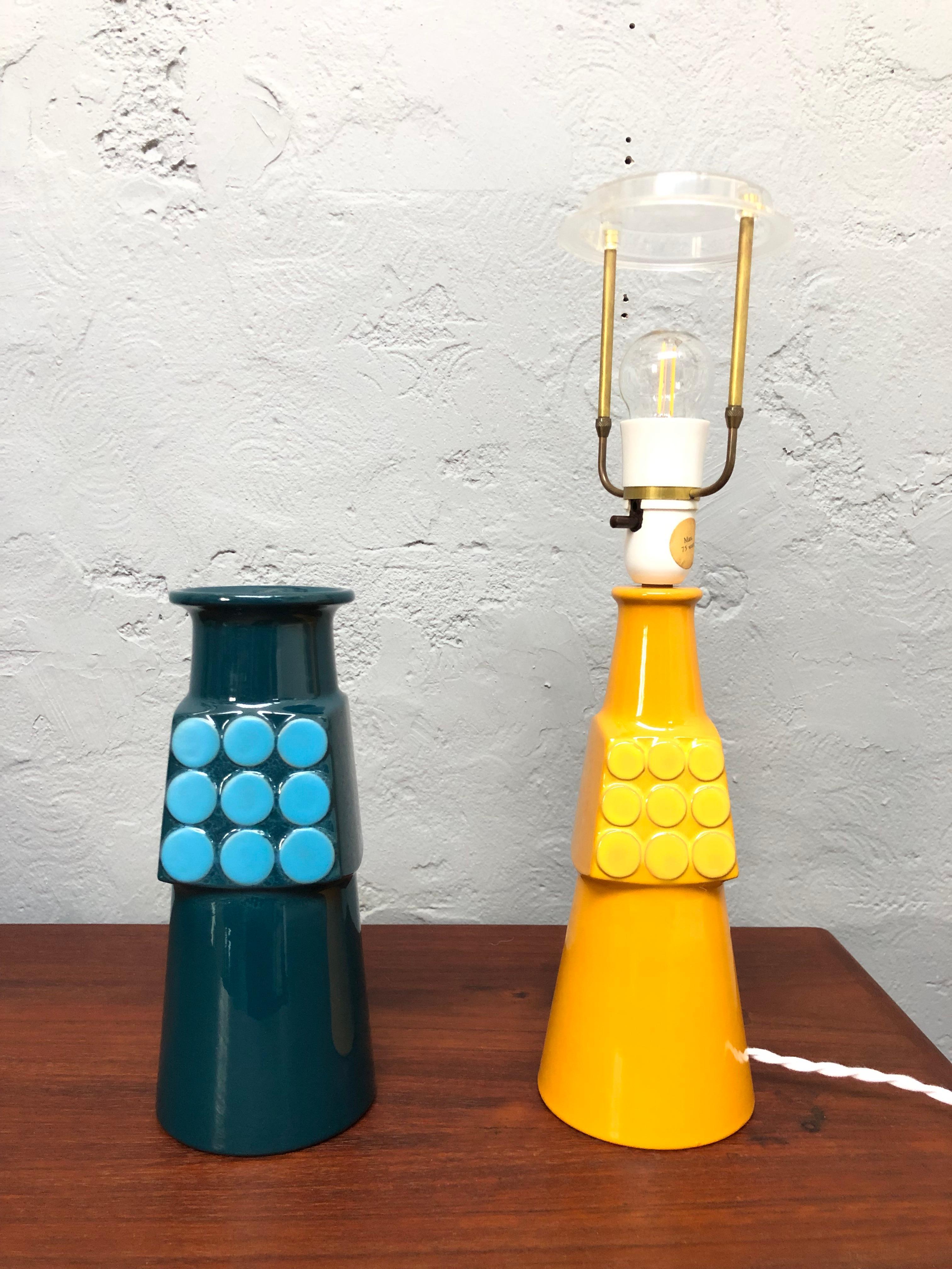 A vintage Knabstrup pottery table lamp with matching vase. 
In great vintage condition. 
Rewired in white cloth twisted flex. 
Still with its original plastic bulb holder with on/off switch. 
Also with its original abjustable lampshade holder. 
Both