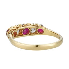 A vintage ruby and diamond half hoop ring