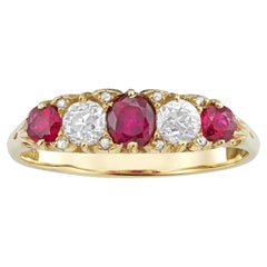 A vintage ruby and diamond half hoop ring