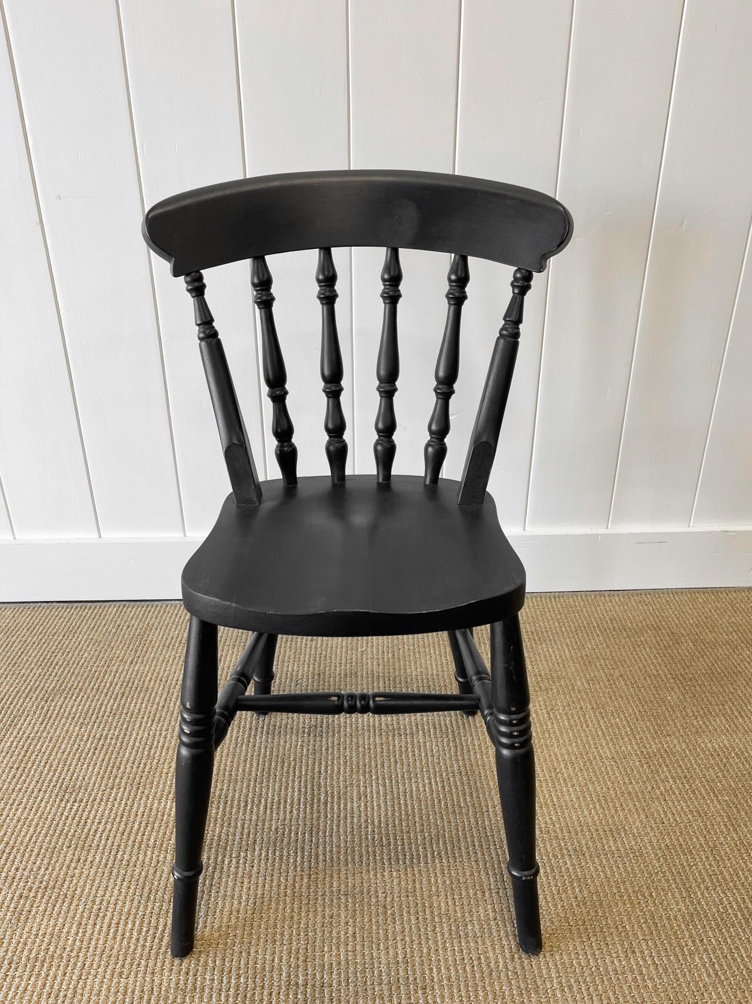 A good set of vintage ash spindle back side chairs painted black. Very solidly built in the traditional way.  Handsome profiles and good and heavy.  Perfect around a farmhouse table! Solid in joint. These are not antiques.

Condition: scratches,