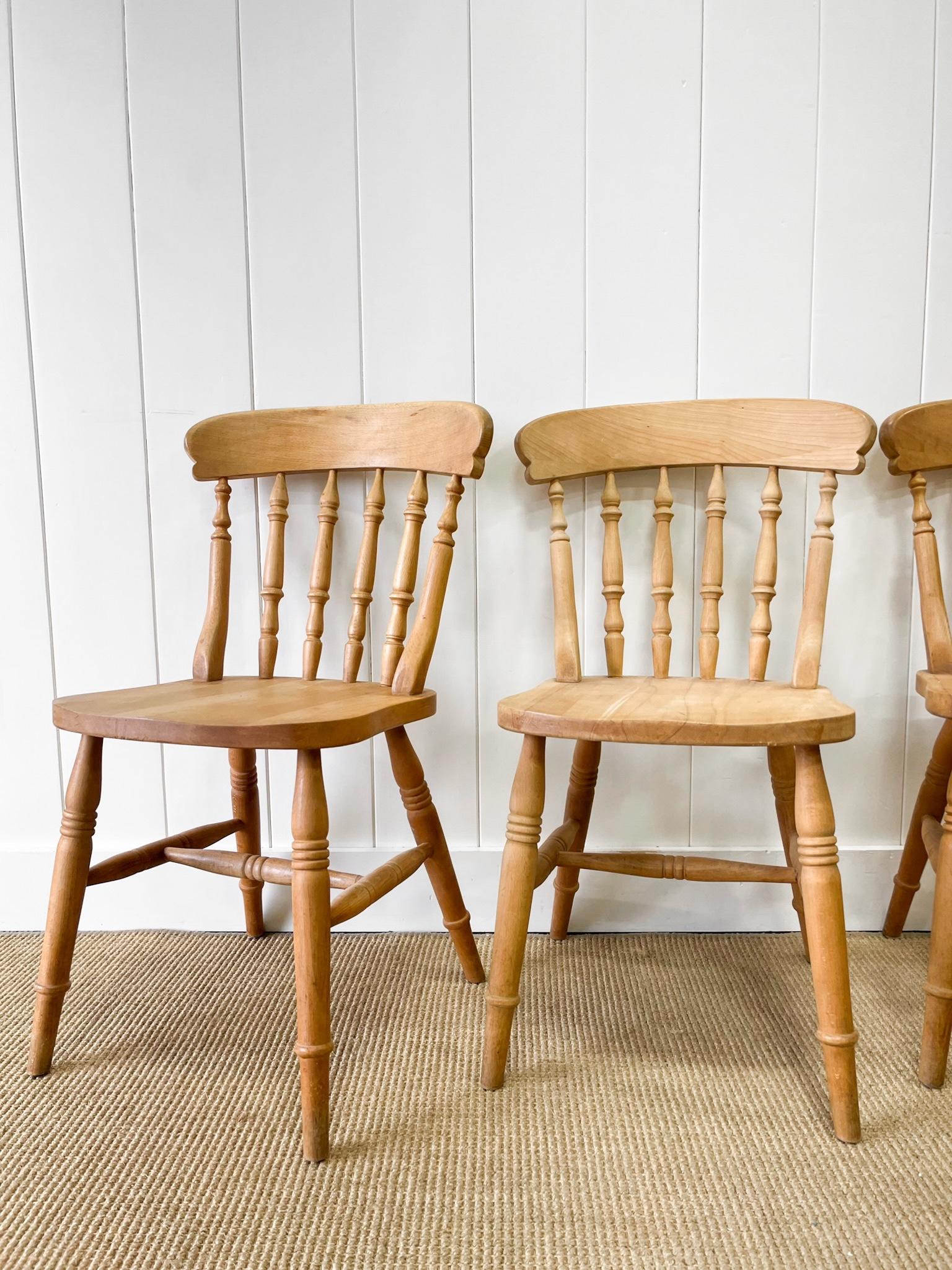 A good set of vintage ash spindle back side chairs. Very solidly built in the traditional way.  Handsome profiles and good and heavy.  Perfect around a farmhouse table! Solid in joint. These are not antiques.

Condition: scratches, dents, marks,
