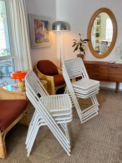 A vintage set of 9 white metal chairs in the style of Egon Eirmann, in France