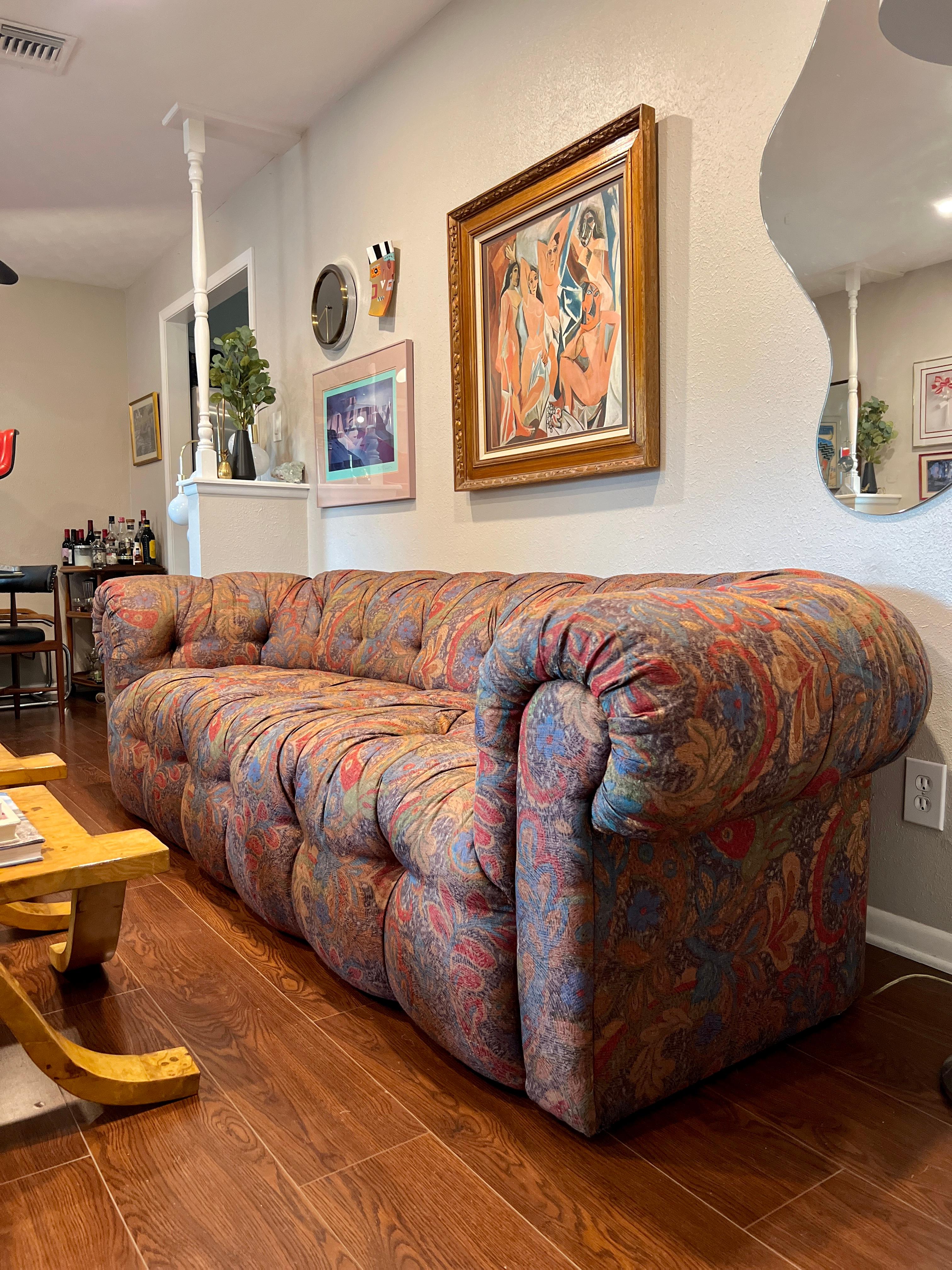 A vintage tufted chesterfield sofa with original jewel tone paisley upholstery. No tears or rips and in good condition. Does not have a makers mark attached but I can confirm that this sofa is by Drexel. 

Dimensions:
102