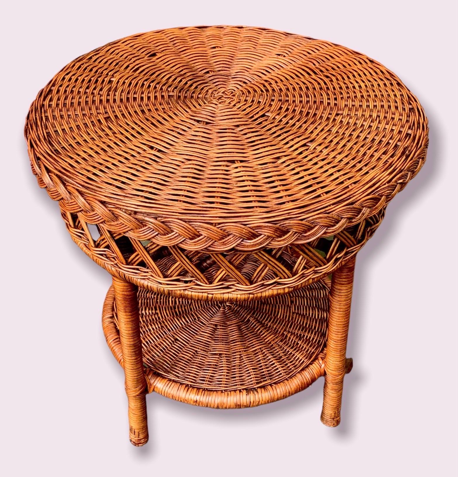 A high quality, vintage 1970’s hand woven wicker over rattan round end/side table with one lower shelf. Ready to enjoy beside your favorite reading chair or sofa and to add an earthy touch to your existing fabrics and finishes, as it meshes well