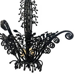 A Vintage Wrought Iron Chandelier with Foliage Motif