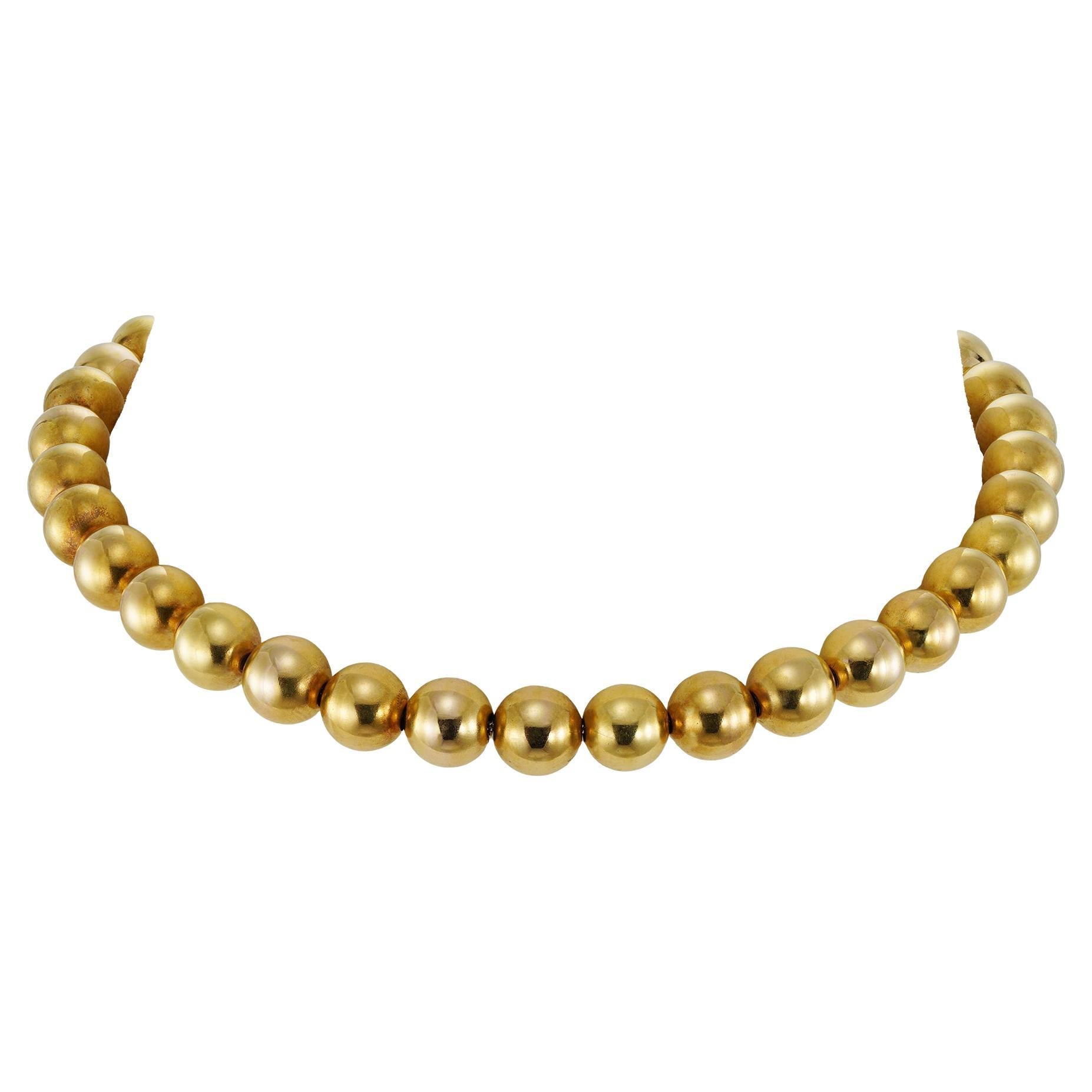 A vintage yellow gold bead necklace