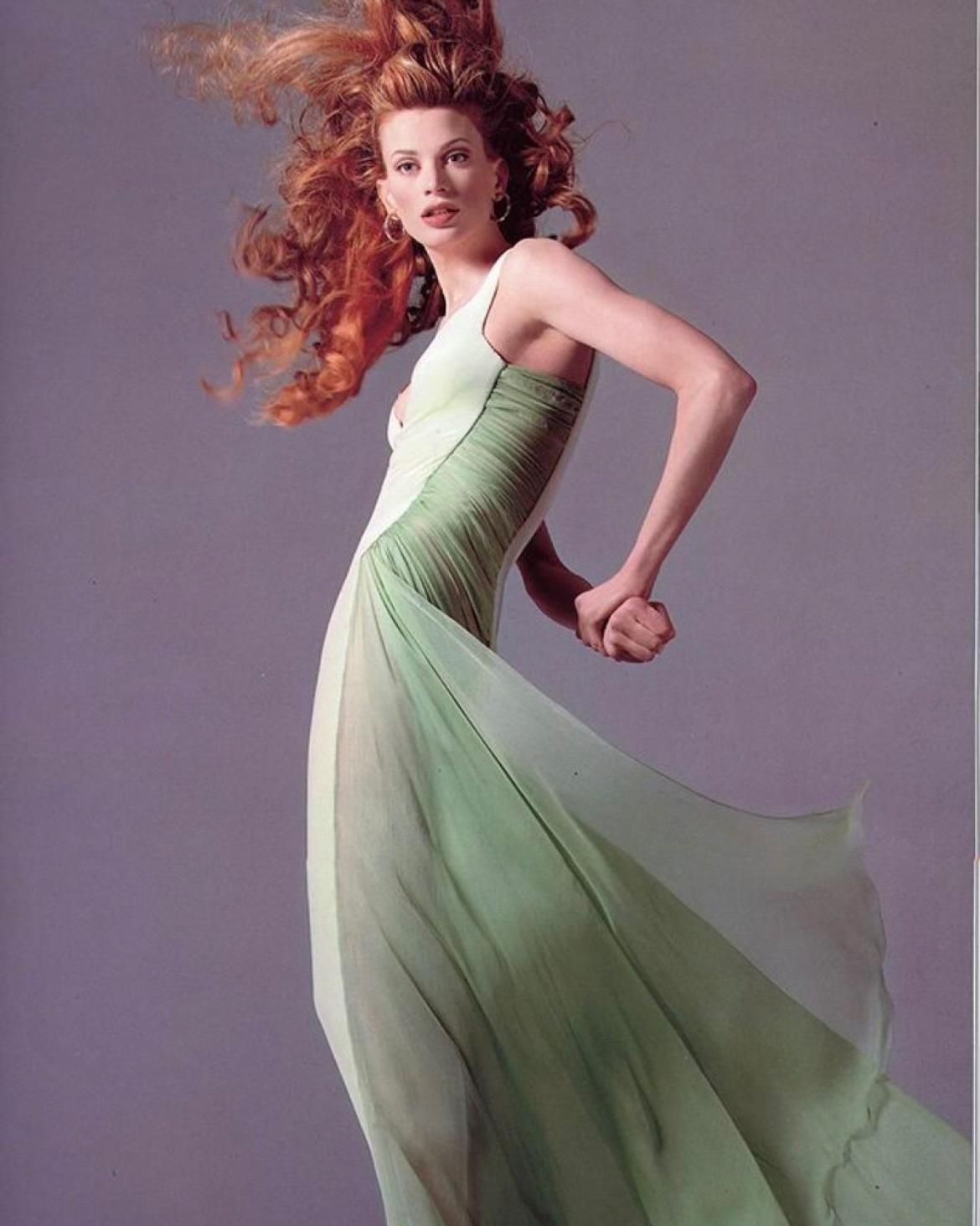 A/W 1995 Gianni Versace green silk chiffon and velvet gown. Soft light green velvet gown with silk chiffon ruching at side and flowing hemline. Features built-in corset and bodysuit and structured bra cups to create shape. Side zip closure and hook