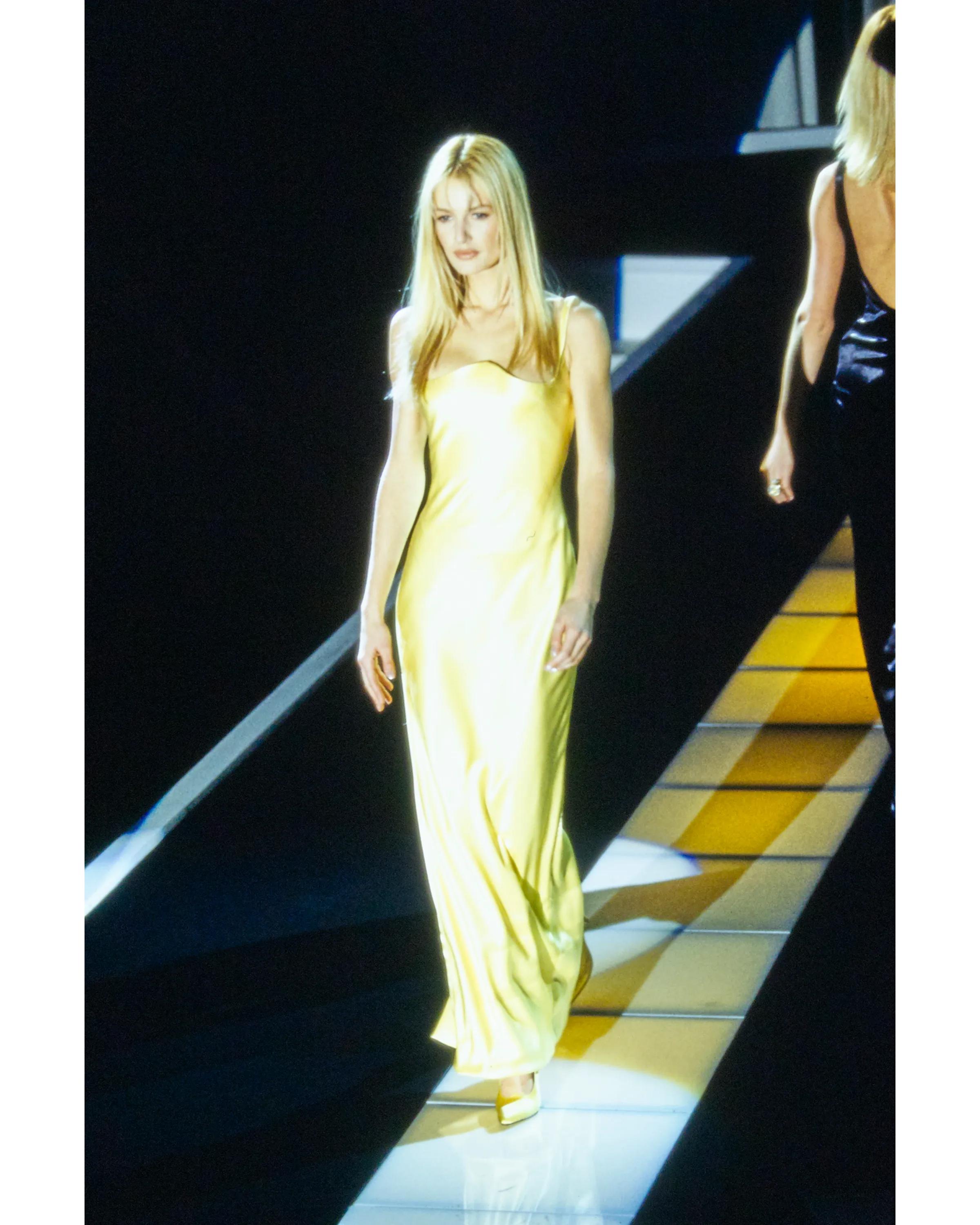 A/W 1995 Gianni Versace yellow silk sleeveless gown with curved bust. Built-in corset with boning and side zip closure. As seen on the runway on Karen Mulder. 