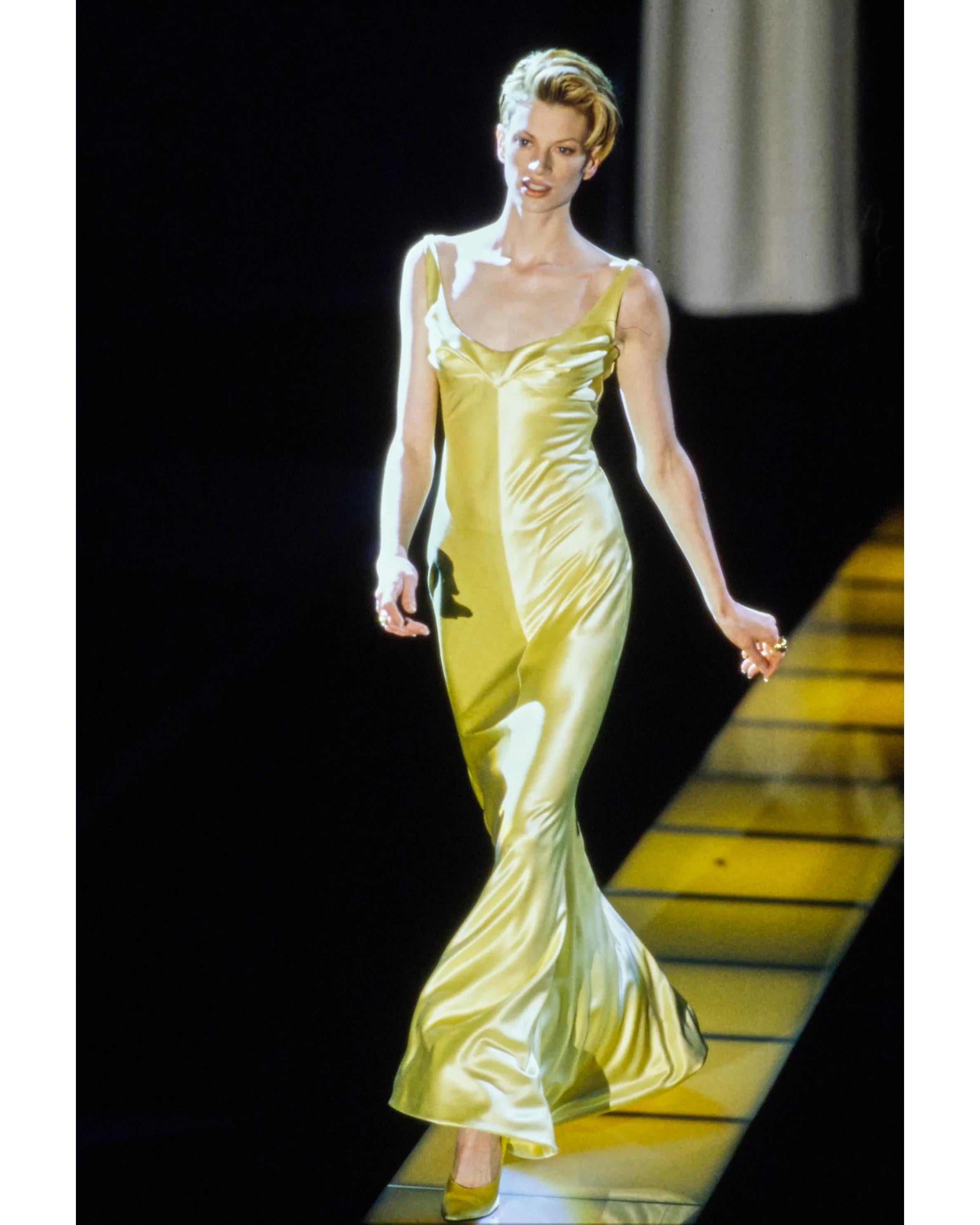 A/W 1995 Gianni Versace yellow silk satin gown with pleated twist bust, from the provenance of Gail Elliott. A one of one (only green colorway of this dress went into production). This piece was gifted to model Gail Elliott from Gianni Versace