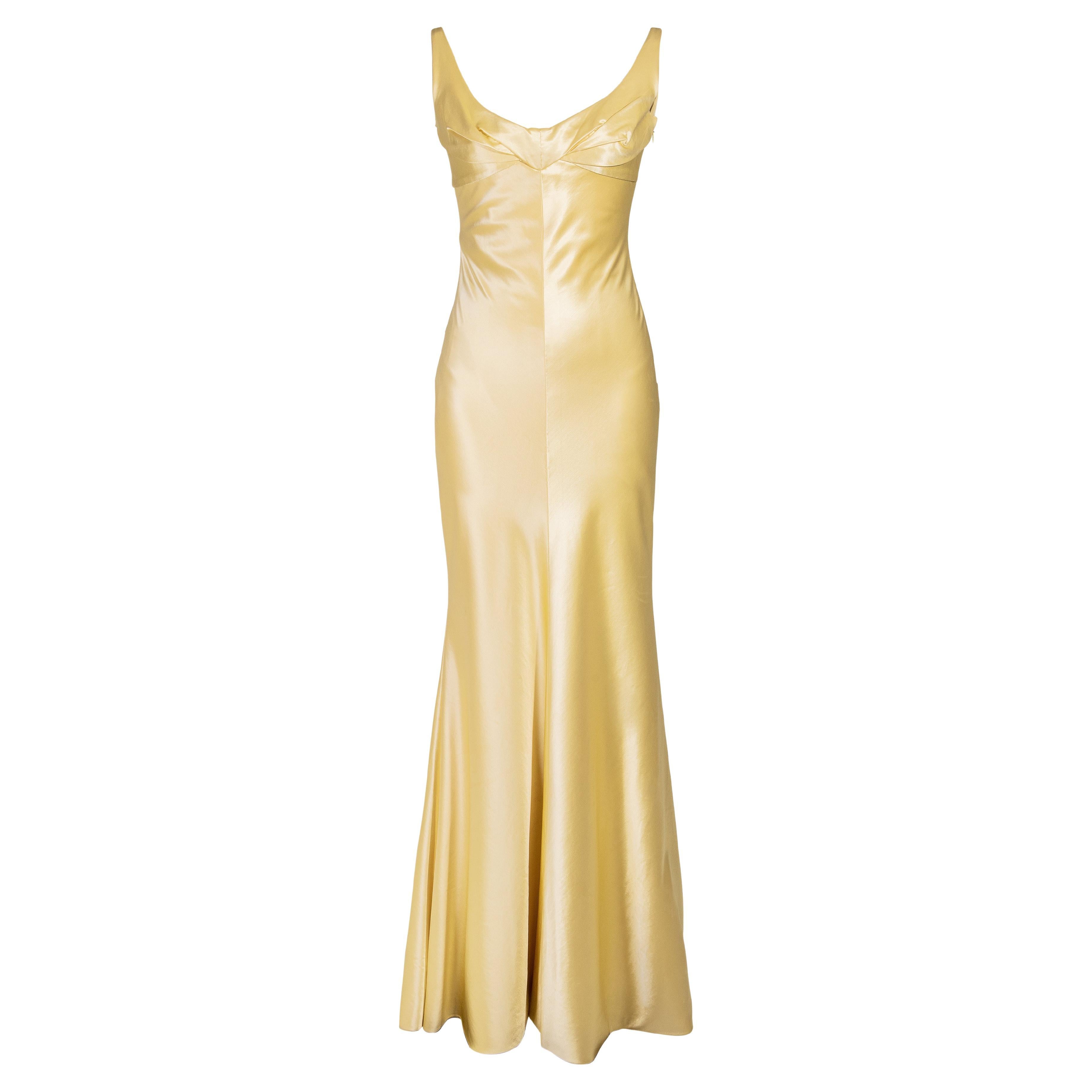 Elegant Yellow Satin Silk Gown with Pochu Sleeves and Sequence Work