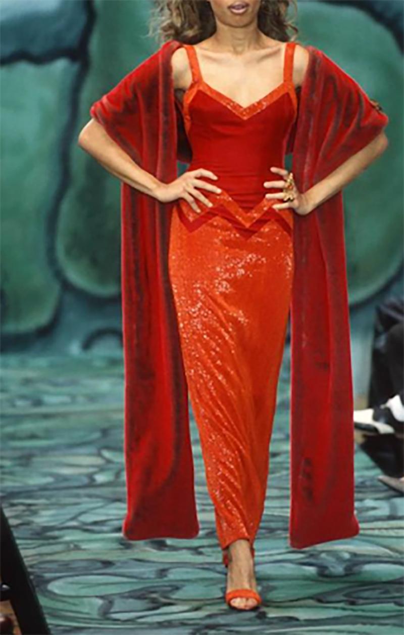 A/W 1996 Todd Oldham gown with vibrant red-orange velvet bodice and sleek orange fully hand beaded skirt. Full length gown with V-neck shape and open back. Chevron patterned lines shape the bodice and add dimension. As seen on the runway.