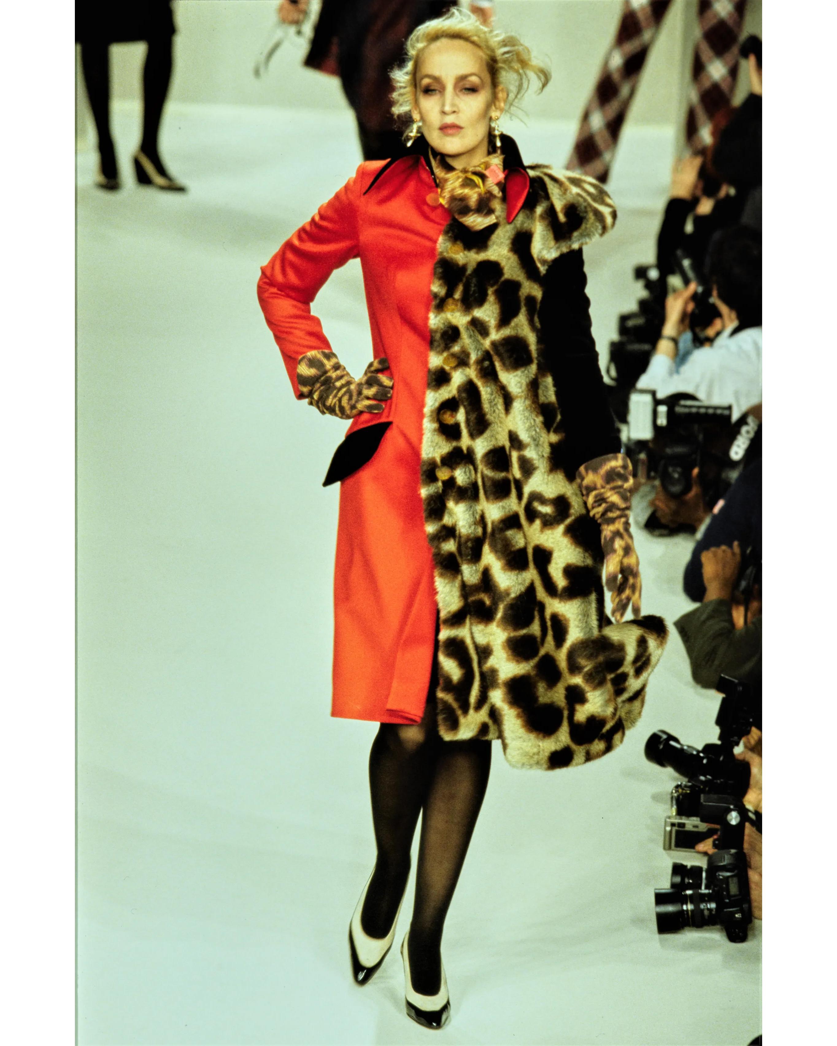 A/W 1996 Vivienne Westwood Gold Label 'Storm in a Teacup' Collection red and leopard print contrast knee length coat. Right side features red coat, and left side features contrasting leopard faux fur short sleeve overlay with black velvet long
