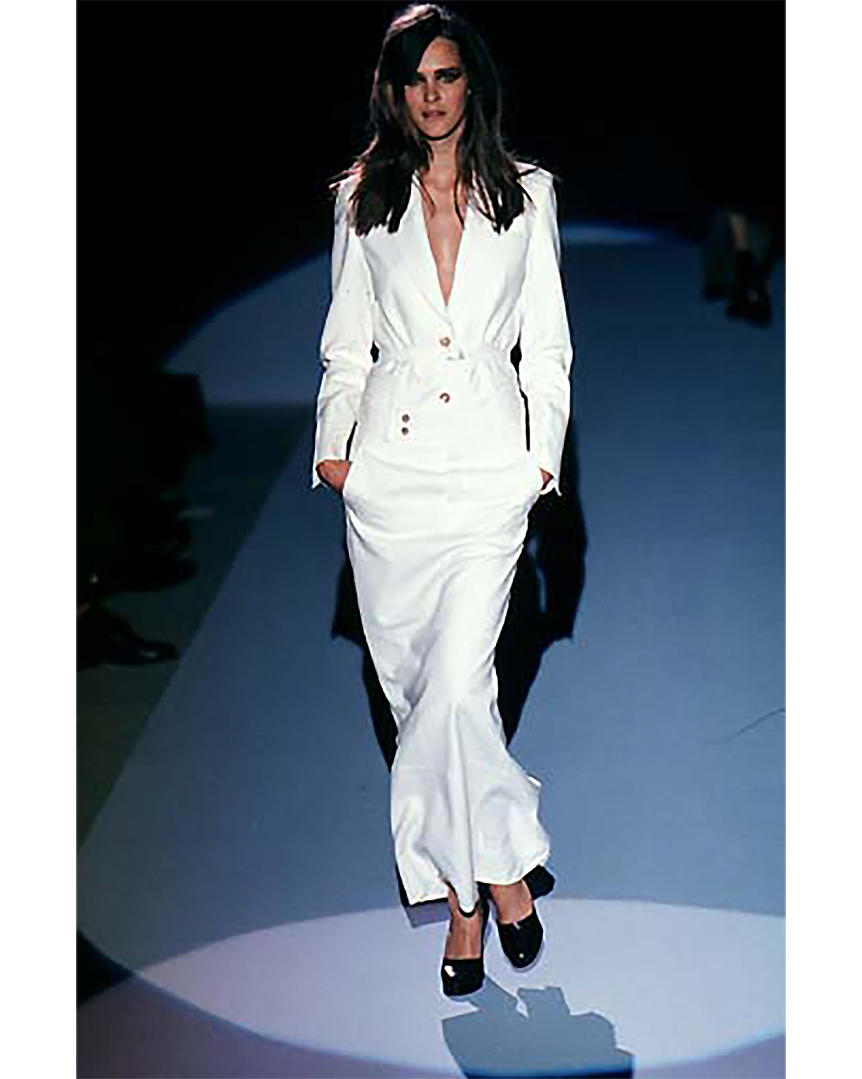 A/W 1998 Gucci by Tom Ford ecru skirt set. Button-up collared blazer with maxi skirt with high back slit. Jacket has slight built-in shoulder pads. Off-white 100% felt wool fabric throughout. Skirt has front button closures and features signature