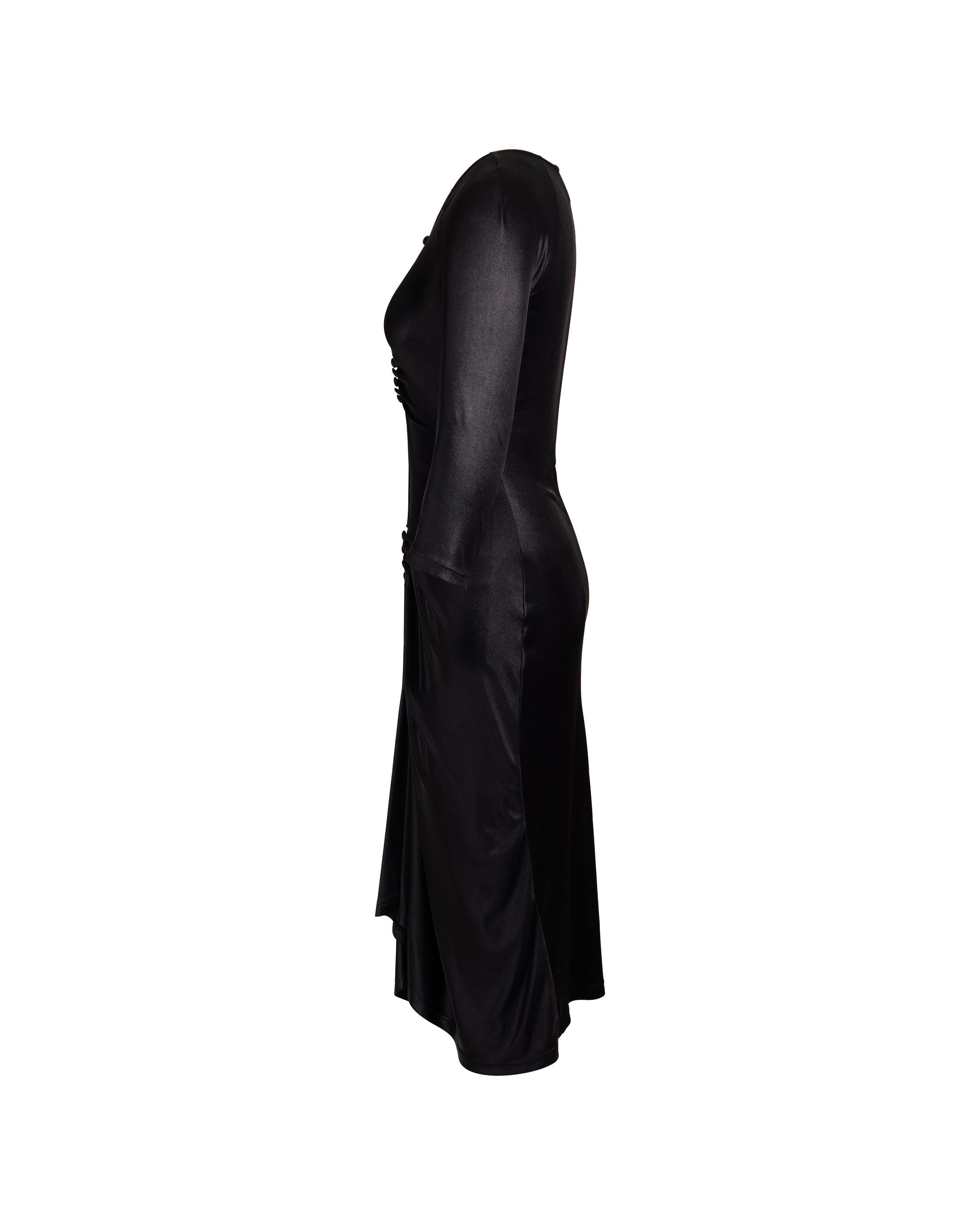 A/W 1998 Vivienne Westwood Red Label black nylon and jersey midi length dress with draped front, cascading towards center black button details. Minor stretch throughout. Fabric gives a ‘wet’ shimmer look that flatters the body. As seen on the