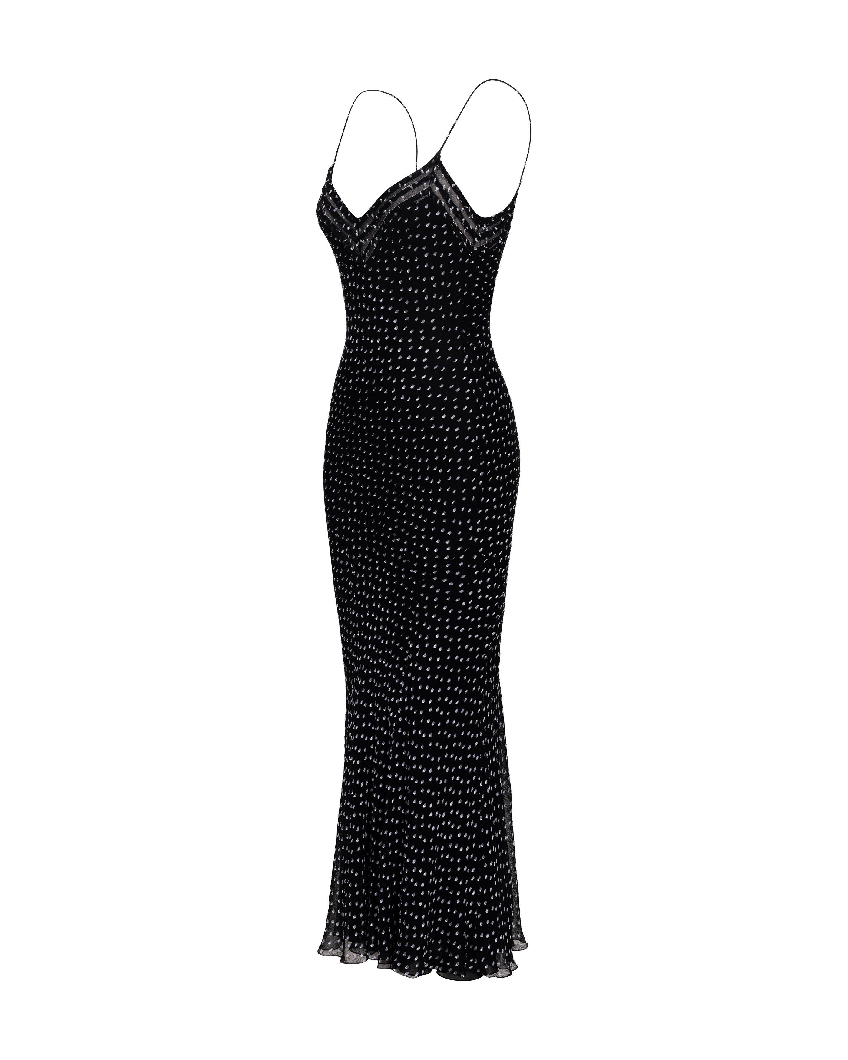 A/W 1999 John Galliano bias cut black and white bias cut polka dot slip gown. Silk chiffon sleeveless spaghetti strap slip midi dress/gown with semi-sheer striped mesh paneling at bust. Fully lined with black silk lining. Pull-over dress with no