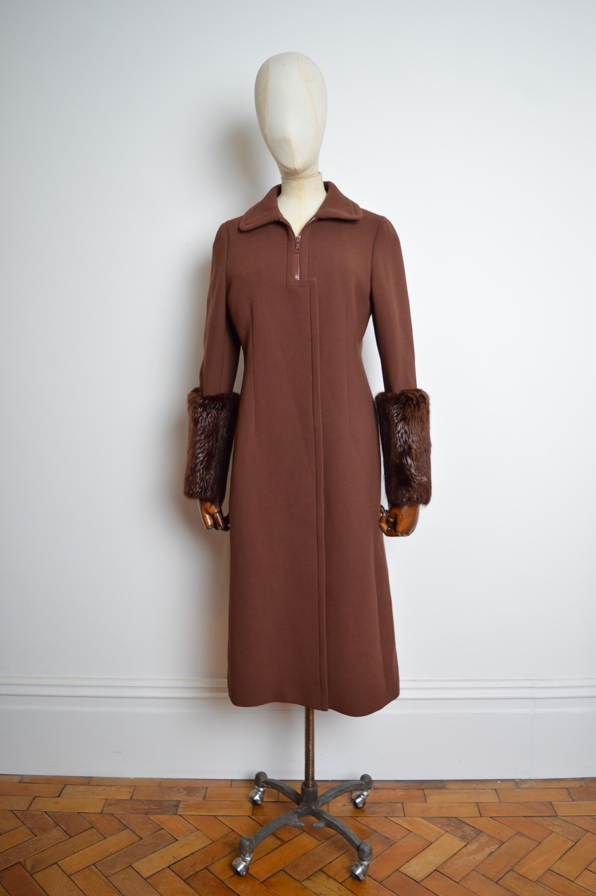 Superb long Chocolate brown wool coat designed by Miuccia Prada for the A/W 2001 Collection. ( Look N015 )

Press stud closure - RiRi Zip hardware - Pure Silk lined interior - decorative panel detail on the back.
MADE IN ITALY. 
Pit to Pit; 18”
Pit