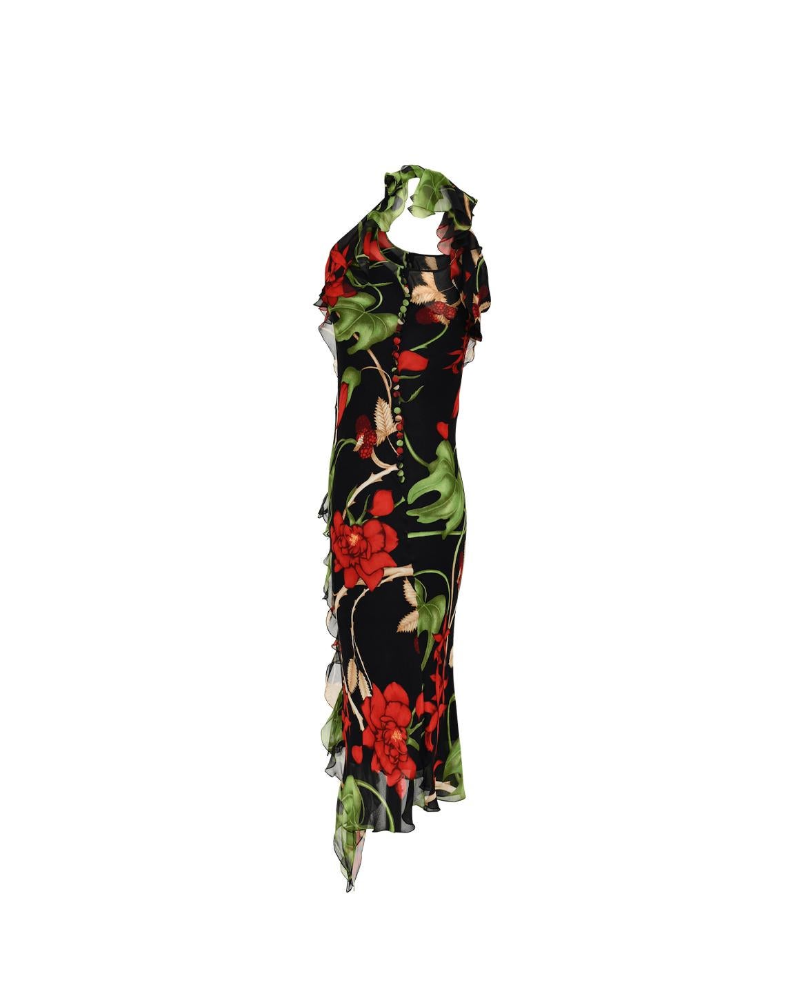 A/W 2002 Christian Dior by John Galliano asymmetrical silk dress. Dark tropical pattern with black beaded straps on one shoulder. Ruffles drape on one shoulder and across body. Galliano signature 1930s fabric covered button closure at side. As seen