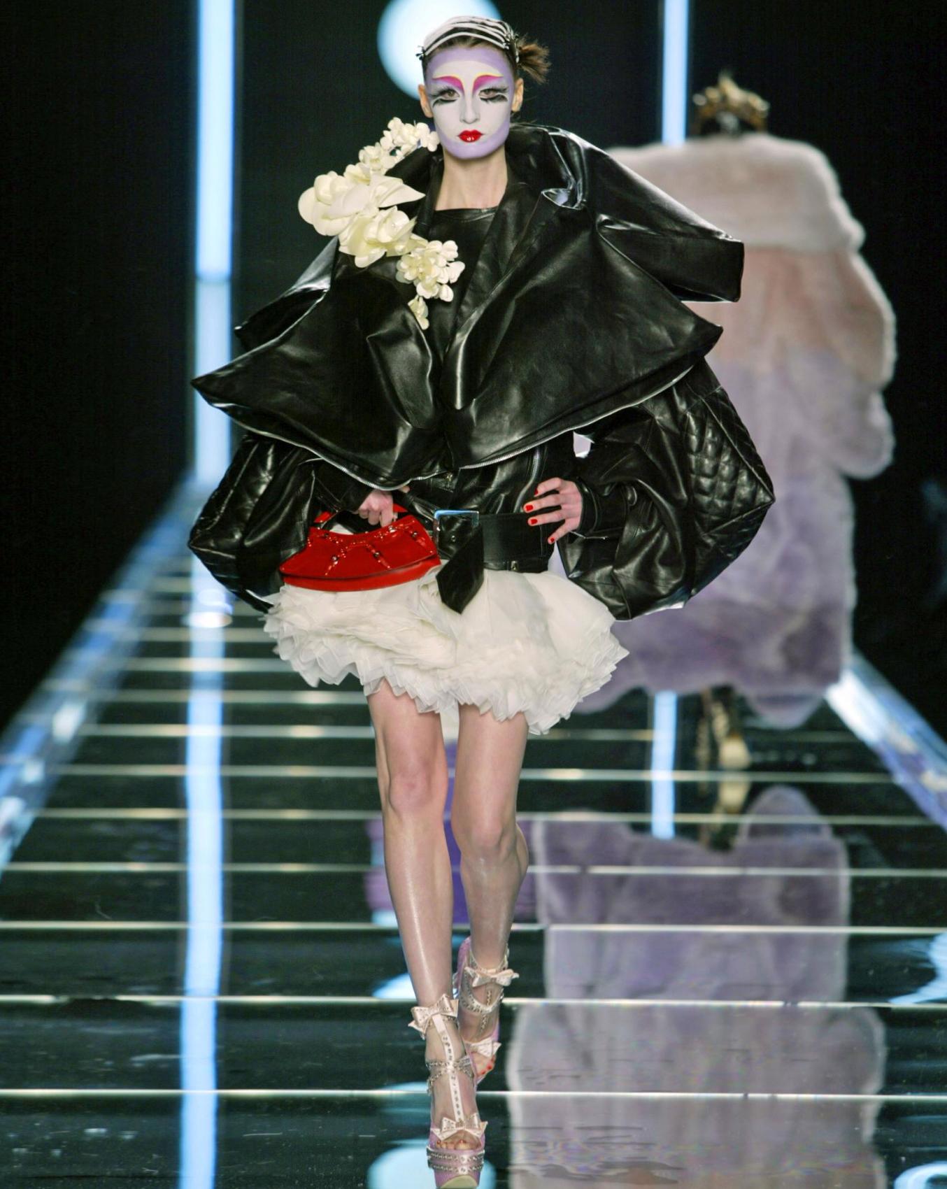 A/W 2003 Christian Dior by John Galliano ecru silk-satin mini skirt with ecru organza layered ruffle hem. John Galliano signature 1930's inspired fabric button side closures. As seen on the runway. Fabric Contents: 100% Silk with 100% Polyester