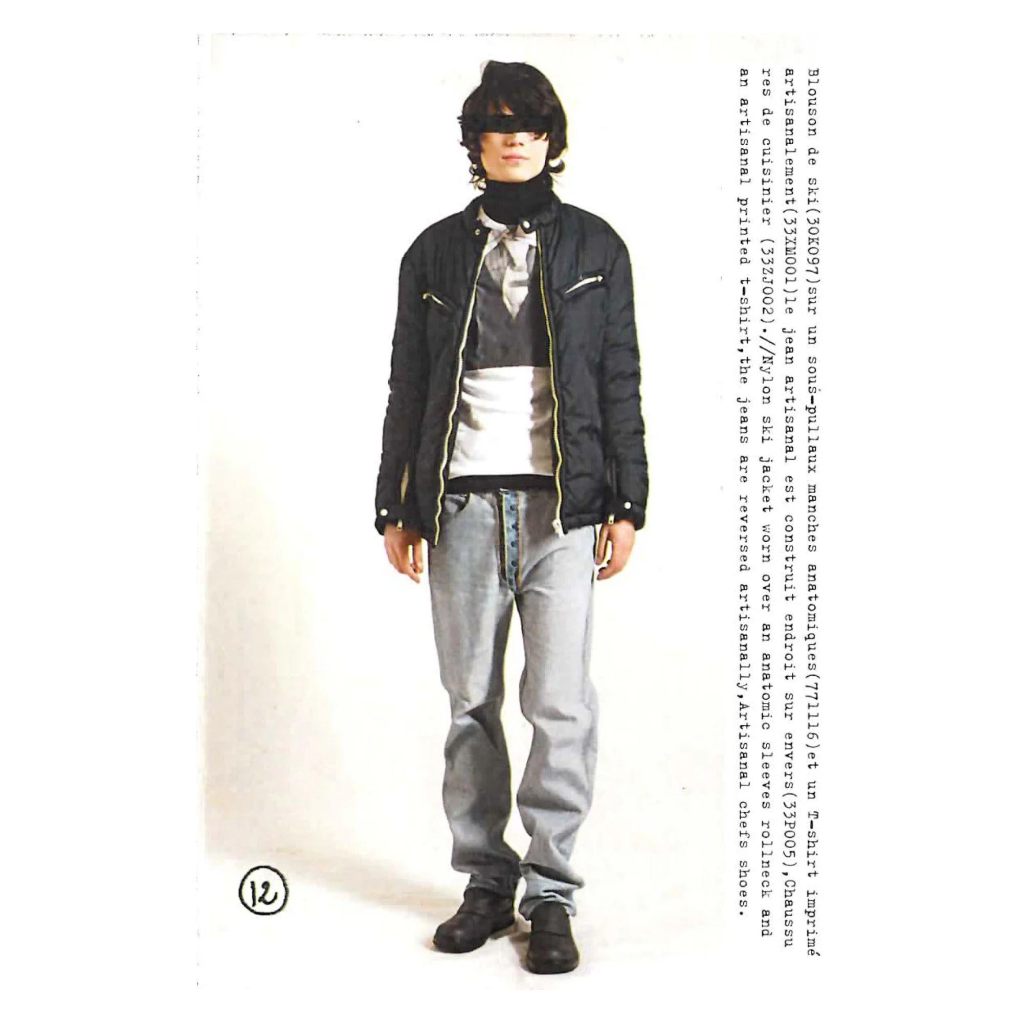 A/W 2003 Maison Martin Margiela artisanal jeans with inverted button-up front detail. These jeans were originally vintage denim Levi's, turned inside-out for a reverse variation. High-rise jeans with snap closures at crotch and tan contrast