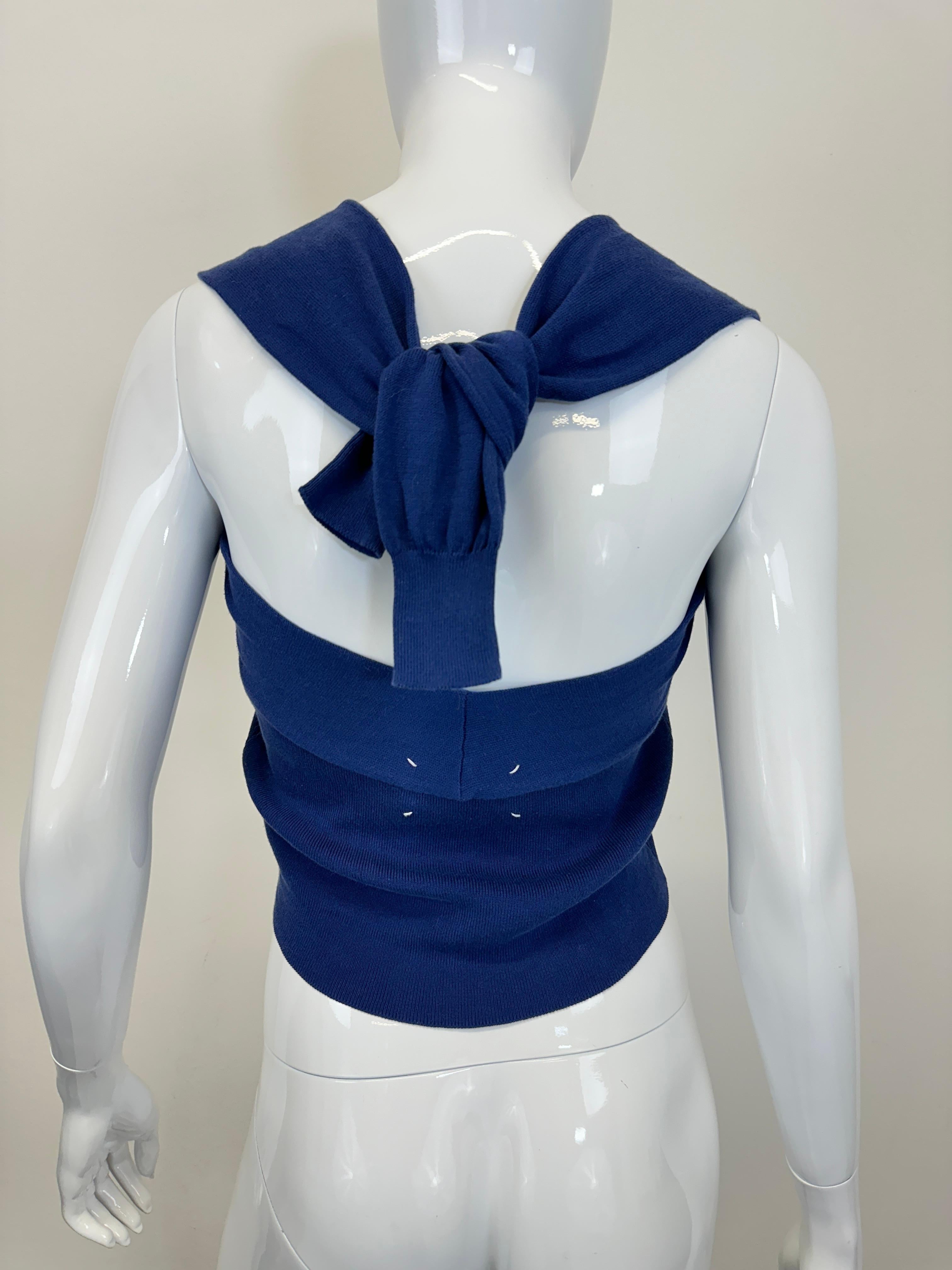 Maison Margiela White Label 2007 blue cardigan tank top, featuring faux sleeves designed to be laced around the neck like a scarf.
Deconstructed design. 

Great conditions, unnoticeable signs of wear shown on pictures

Size M, check detailed