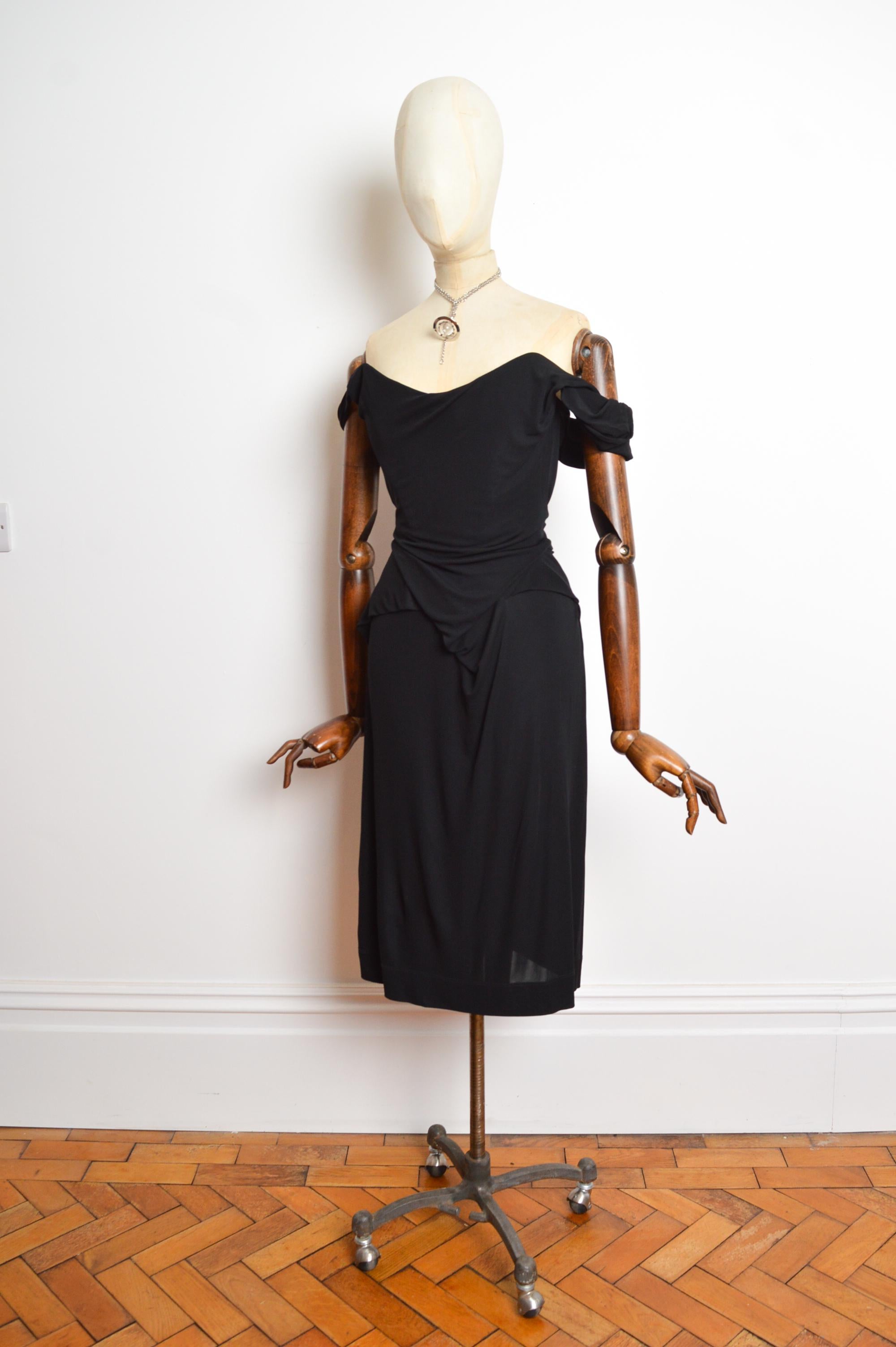 A fabulous Vivienne Westwood cocktail dress with built in corset structure from the Autumn / Winter 2008 collection featuring a boned, figure hugging silhouette. 
Size; Small (UK 8)
Measurements are provided in inches (‘’)
Pit to Pit; 17”
Nape to