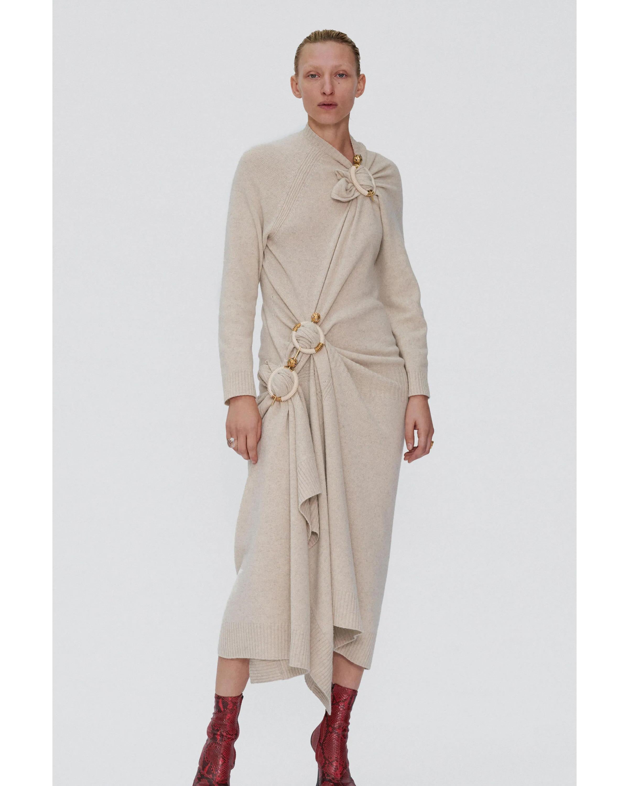 A/W 2018 Old Céline by Phoebe Philo cream knit wool blend midi dress. Asymmetrical dress with snap waist closure and layered skirt. Features ribbed trim details throughout with minor stretch. As seen in the lookbook (Look 20), styled with pins (not