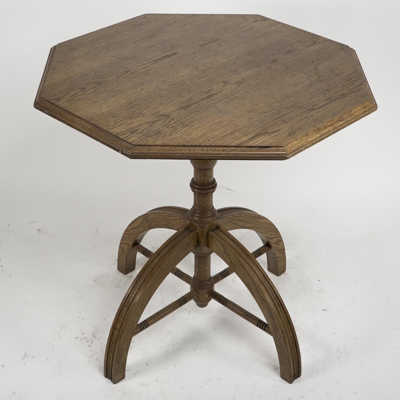 A W N Pugin after a design by. A modern craftsman made Gothic Revival oak octagonal centre table with a central upright turned column that passes through the arched legs uniting the lower legs by radiating turned stretchers.
Circa 1980's.