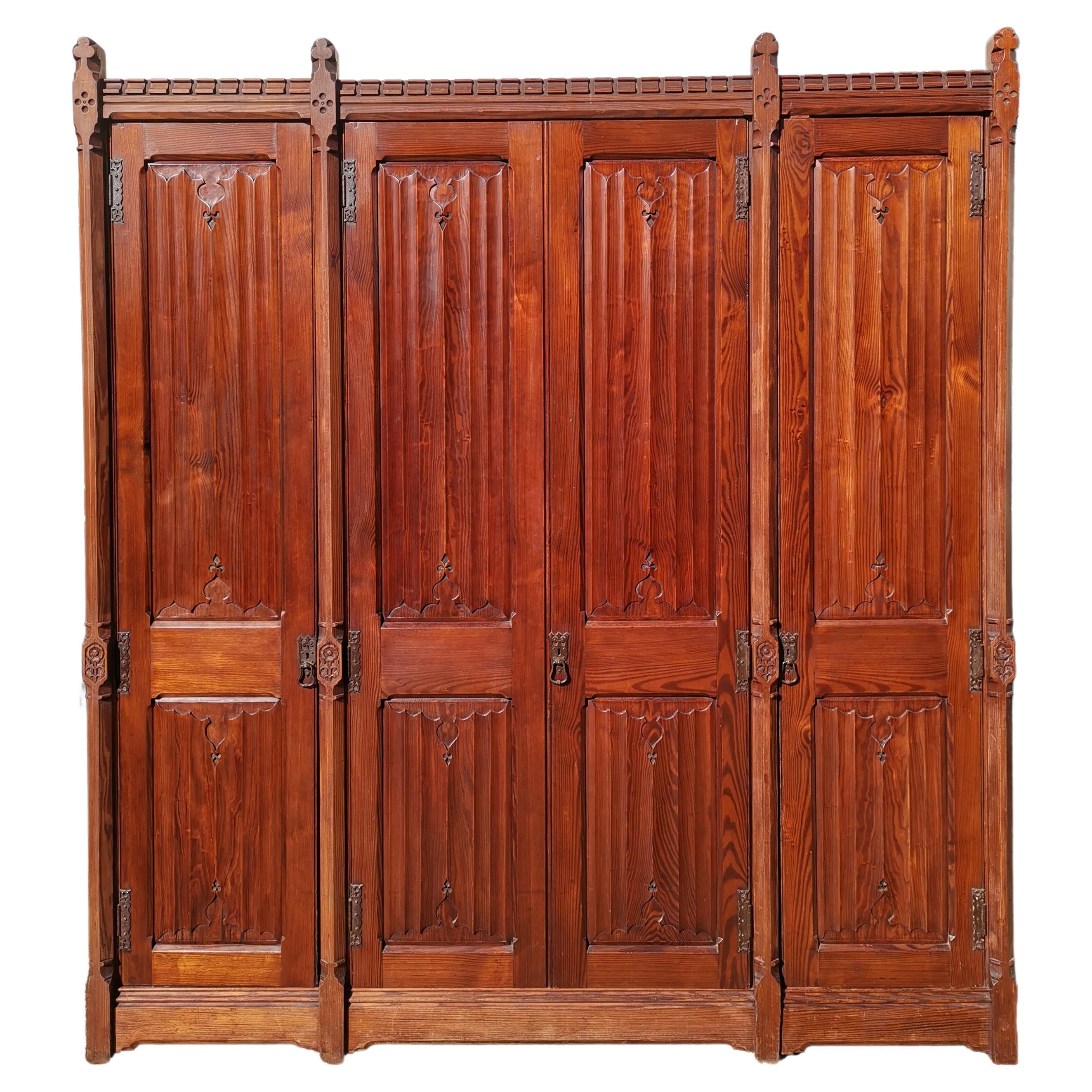 A W N Pugin. Gothic Revival Four Door Pitch Pine Wardrobe with Linenfold Panels For Sale