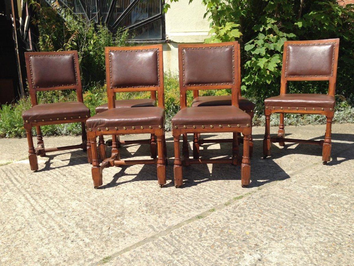 A W N Pugin, made by Gillows of Lancaster. Stamped Gillows to the back legs.
A set of six Gothic Revival oak dining chairs. An unusual set having the upholstery to the back rests with show wood around, these chairs are usually completely
