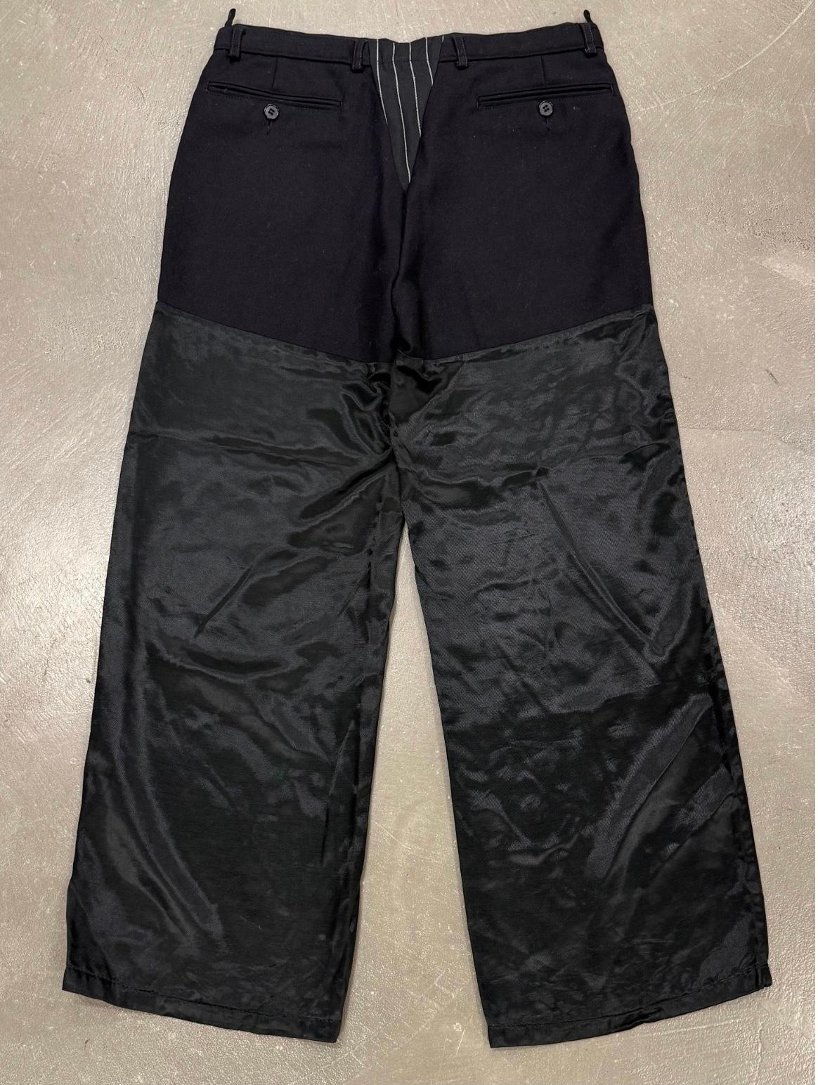 A/W 2002 Maison Martin Margiela artisanal hybrid reconstructed pants

These Maison Martin Margiela pants from the Autumn/Winter 2002 collection embody the house’s deconstructive and conceptual approach. Crafted as part of the Artisanal line, they
