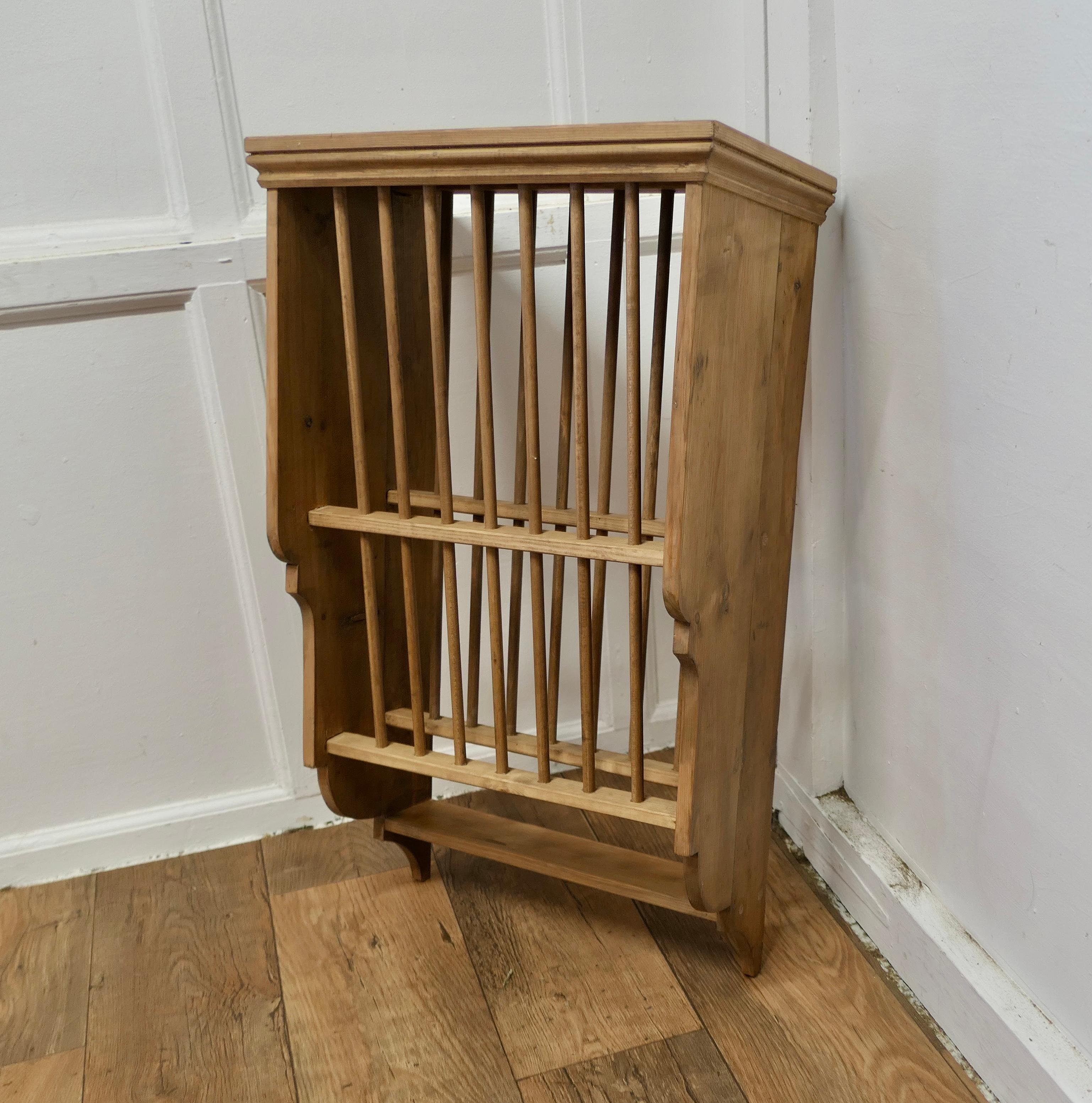 A Wall Hanging Pine Plate Rack


This useful piece hangs on the wall and drains and stores plates until required
It has a pine frame and wooden dowels with a waterfall shape, allowing 2 rows of plates to be stored at any one time, below there is a
