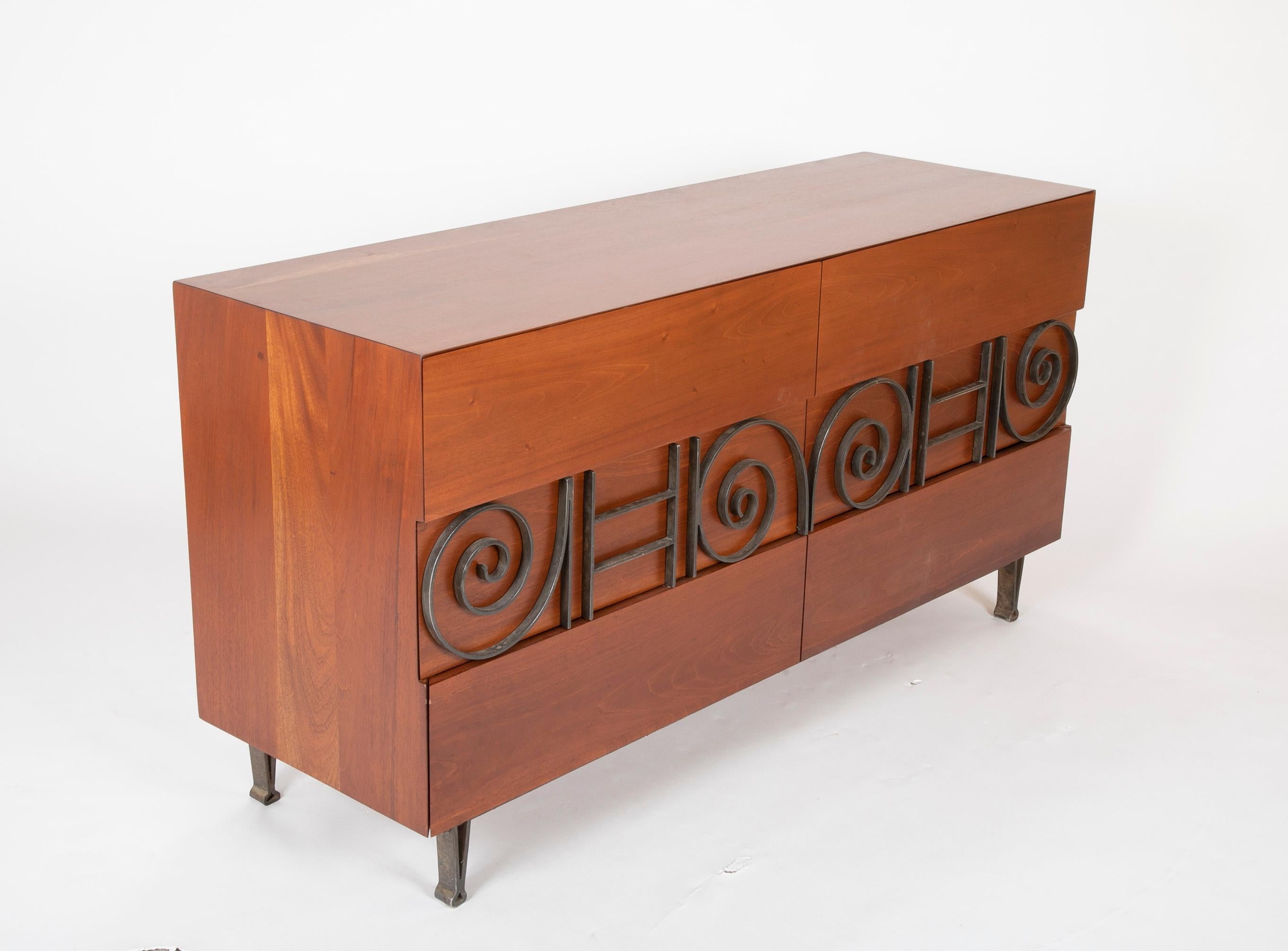 A walnut cabinet having two compartments with applied patinated brass decoration. Stamped 