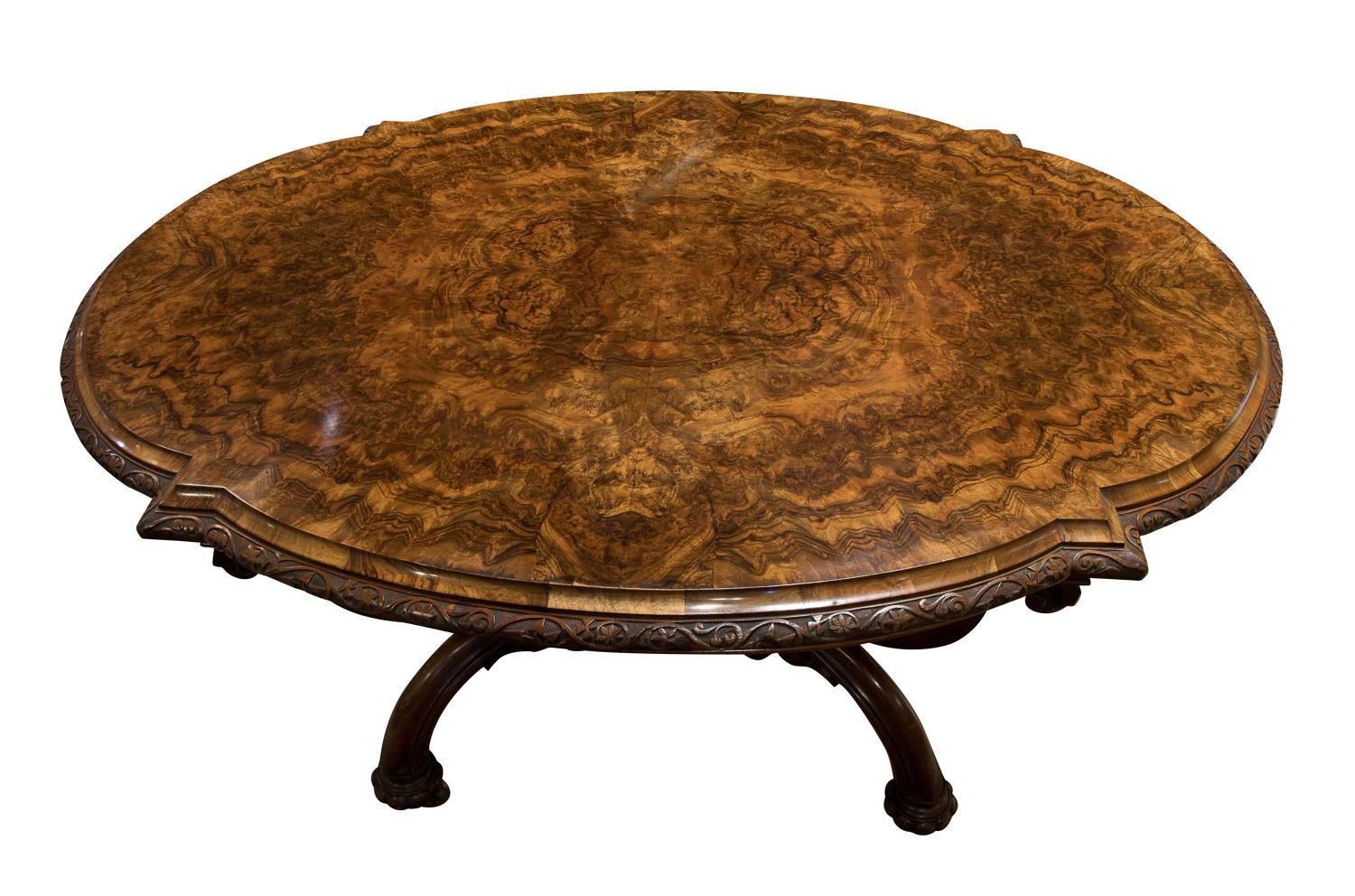 An exceptional quality walnut and burr walnut centre table with a carved basked shaped base. Well carved border to the top and embellishments to the base on brass castors. This is a beautiful and unusual table,

circa 1860.